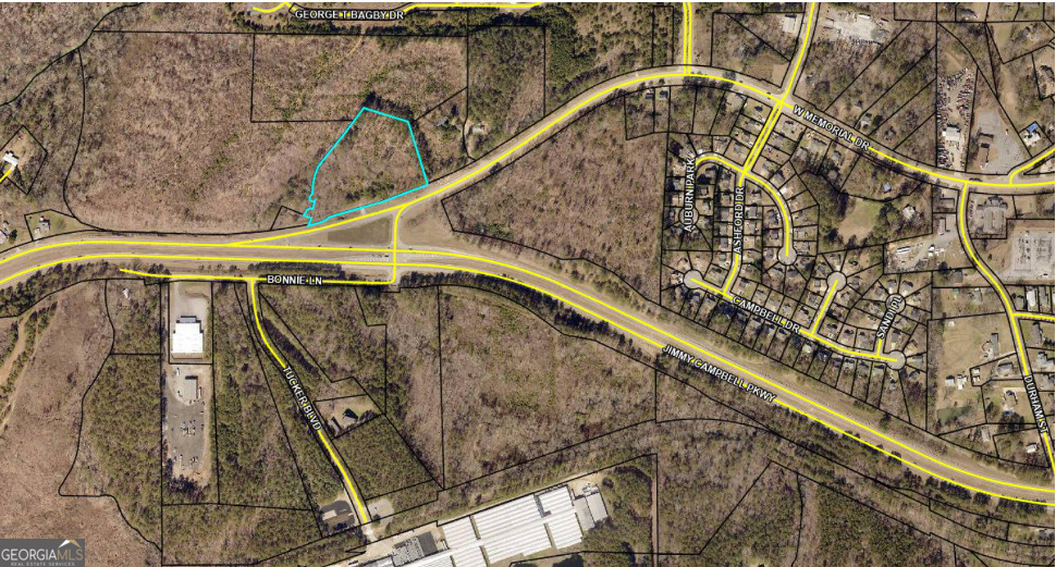 4.47 Acres - PRIVATE HOMESTEAD or Light Industrial / Commercial Development Opportunity in Paulding County, GA This 4.47 acre parcel at 1160 W Memorial Drive offers a rare, shovel-ready vision for transformation into a light industrial and commercial hub. Currently zoned R-2 (Suburban Residential), the property has strong potential for rezoning to I-2, unlocking opportunities for small warehouses, drive-thru retail, and other light commercial uses. The concept master plan seen in the photos envisions: 42,000 sq ft of warehouse space across multiple 1,500-2,500 sq ft units 4,800 sq ft of commercial space, including an 800 sq ft drive-thru shop and a 4,000 sq ft retail package store Ample parking with 77 planned spaces (exceeding county requirements) Strategic placement for billboard advertising along Memorial Drive and Hwy 278 Engineered detention pond and state waters buffer compliance for environmental stewardship Located inside Paulding County (not the City of Dallas), the property benefits from lower taxes while maintaining close proximity to major corridors, retail centers, and residential neighborhoods. High traffic counts along Hwy 278 make this site ideal for businesses targeting both commuter and local markets. Whether pursued as a multi-tenant industrial park, mixed-use commercial complex, or single-user facility, this property delivers exceptional location, infrastructure potential, and growth upside.