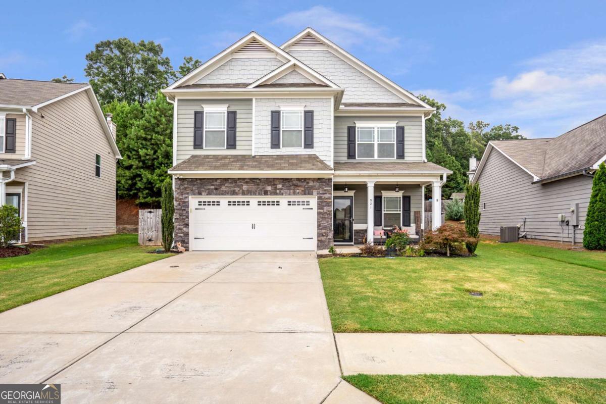 Nestled in the charming Creekside Village neighborhood of Hoschton, Jackson County, GA, this beautiful 4-bedroom, 2.5-bath is waiting for you to make it your home. As you step inside to a welcoming entryway you will be greeted with beautiful luxury vinyl floors throughout the main level, dining room, spacious living room with an open view to the kitchen. This stunning kitchen will be great for family meals and plenty of room to entertain guests with the beautiful Island, white cabinets, granite countertops and so much counter and cabinet space. As you travel upstairs you will be greeted with the spacious master suite with his and hers closets, a relaxing garden tub, and a separate shower plus 3 spacious secondary bedrooms and a full bath. Outside, this home has a covered front porch and a covered back porch with a fully fenced back yard. Ideally located just 20 minutes from the Mall of Georgia, this home offers easy access to premier shopping, dining, and entertainment. With its proximity to Hoschton City Park and quick access to I-85, this property is a wonderful place to call home! All appliances remain including the refrigerator, washer, dryer and the seller is offering $2000 towards closing costs.