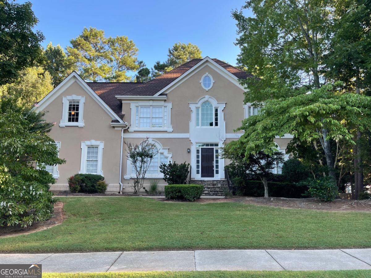 Fantastic home located in sought after Dunmoor subdivision. Dunmoor is a wonderful neighborhood with sidewalks throughout, a neighborhood pool, swim team, clubhouse, tennis courts and children's playground. The location of this wonderful house can't be beaten, the school bus stop is in front of this house! It has top-rated schools, minutes from Avalon and GA 400, and within walking distance to the Greenway. This home is on a level lot with a fenced and private backyard. Gourmet white kitchen includes granite countertops, SS appliances, tiled backsplash and is open to the family room and sunroom. The master suite is oversized with a sitting room, his/her walk-in closets, and a renovated bathroom with a frameless shower, travertine floor, double vanities. The daylight basement includes a full kitchen, full bathroom, 2 rec rooms, and a bedroom. The basement will be getting a complete renovation upon current tenants moving out. Updated pictures once renovations completed. Owners pay for lawn maintenance. Security deposit due 24 hours after binding lease. First and last months rent due 5 days prior to lease start date.