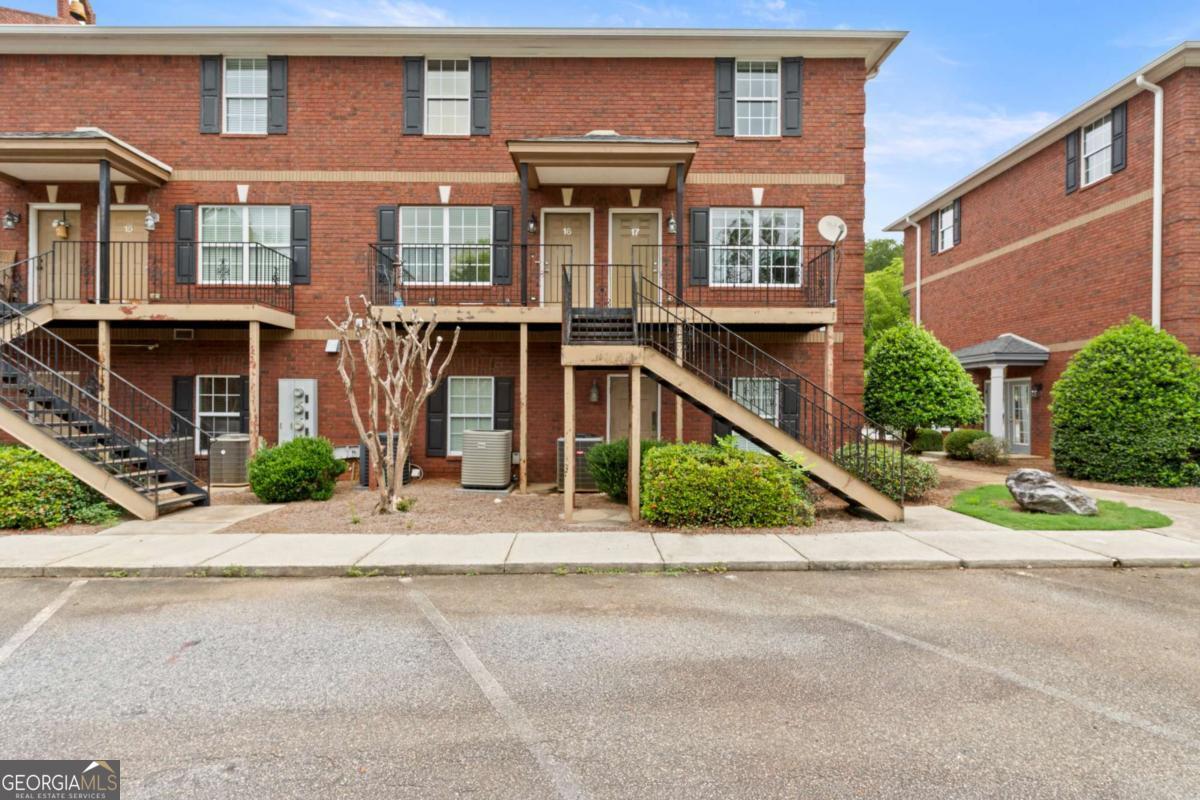 Conveniently located just minutes from the loop and less than half a mile from the new Oak Grove Shopping Center, this 2BR/2.5BA condo in Jefferson Place offers low-maintenance living in the heart of Athens. The main level features an open-concept living/kitchen area, half bath, and laundry closet with a washer/dryer included. Upstairs you'll find a spacious primary suite with double closets and private bath, plus a second bedroom and full hall bath. HOA covers trash, exterior maintenance, and lawn care, two parking spots are assigned for this unit. Just 3 miles to UGA Medical Campus, Normaltown, and Piedmont Athens Regional. Great for an investor with a solid previous rental history.