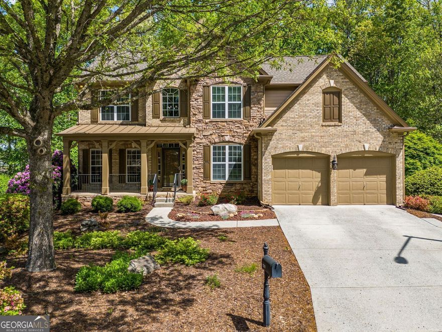 Welcome to the Home That Has It All! Crafted for Connection, Designed for Comfort. This lovely Craftsman-style home sits in a quiet cul-de-sac. Its charming stone and brick exterior, along with the landscaped front yard, create a warm welcome. Enter the spacious two-story foyer and be welcomed by the bright great room. The wall of windows and the double-sided fireplace create a relaxed elegance.  The open-concept kitchen features a large custom island, granite countertops, stainless steel appliances, a gas range, and a cozy keeping room with a stone side of the double fireplace. The eat-in breakfast area opens directly to a roomy back deck. From there, you can admire the well-kept, fenced backyard filled with flowering bushes and shade trees.  Hosting formal dinners is easy in the dining room. It seats over 12 guests comfortably. Plus, it connects to a custom butler's pantry. This space is great for prep, storage, or a coffee and wine bar. A separate living room or office and a full guest suite on the main level provide added flexibility for work or visitors.  The primary suite upstairs is a relaxing respite. It has a wall of windows and built-in shelves around an electric fireplace. The luxurious bath features a frameless glass shower, a slipper soaking tub, double vanities, and a boutique-style walk-in closet. Three additional bedrooms share a spacious bath with dual vanities, while the upstairs laundry room features built-ins for added convenience.  The finished terrace level offers ultimate flexibility, perfect for an in-law or teen suite, complete with a large bedroom, full bath with double vanities, walk-in closet, and its own living space featuring a corner fireplace. The fully equipped kitchen, stacked washer/dryer, laundry sink, and additional toilet in the storage area make it ideal for multi-generational living or long-term guests, with easy walk-out access to the level backyard and its own private walkway from the cul-de-sac to the terrace level door.  The home boasts upgraded moldings, custom built-ins, and modern lighting, creating a cozy and welcoming atmosphere. It's an ideal space for gathering, growing, and making memories.  This isn't just a house. It's the next chapter...ready for you to make it your own.