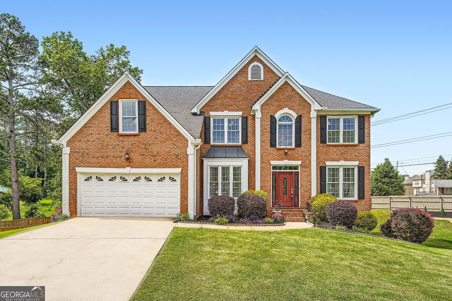 **UPDATE: Brand NEW ROOF has been completed/installed as of 5/24/2025. (Cost benefit to buyer: approx. $20,000, seller reported)    -  **SPRAYBERRY HIGH: This property is located within the Sprayberry High school district.    -    3363 Linton Lane is located in Sprayberry High, Daniell Middle, and Addison Elementary school district.    The brick-lined beauty sits on a slightly higher grade than street level, which makes you feel like you're pulling up to a dwelling that stands above the rest.    Being on a cul-de-sac offers added safety for those recreating outside. It also massively cuts down on fast-moving thru-traffic.    THIS GEM IS *NOT* LIKE ANY COMPARABLE HOME NEARBY.    The fully finished basement catapults 3363 Linton's square footage to 4,273 sq. Ft. As of writing, no nearby comps come even close!    Each level has its own HVAC system. The inside units were upgraded in 2023.    The basement (fully refreshed in 2024) offers an open and large living area, a kitchen, and several multi-purpose rooms with a separate entrance. The area could be separated with proper permits and permissions.    On the first floor, high ceilings, many windows, and open spaces give this home an 'airy' and 'fresh' feel.    YOU MUST SEE THE WOODEN FLOORS.  They have been meticulously cared for and shine like they were just installed yesterday.    KITCHEN FULLY REMODELED IN 2020.  New Granite countertops and all-new stainless steel appliances were installed.    Large bedrooms upstairs, and an oversized deck (painted & restored last week) with a level and well-taken-care-of backyard (with pear, fig, and cherry trees) make 3363 Linton a paradise that its next owners can comfortably grow in for decades to come.