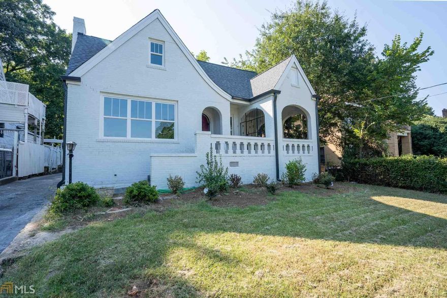Historic Atlanta home for sale! This 1930's 4bd/3bth Masterpiece with STUNNING views of Atlanta's skyline has been renovated down to the studs. Open concept w/ lot's of natural sunlight through out, gleaming hardwoods floors, custom tiled chef's kitchen w/ white cabinets & granite c'tops, SS appliances. Oversized Master Retreat on main w/ luxurious custom tiled shower & sep freestanding tub. Entertain guests in ample sized backyard. This beautiful brick bungalow is conveniently located in the heart of the city!