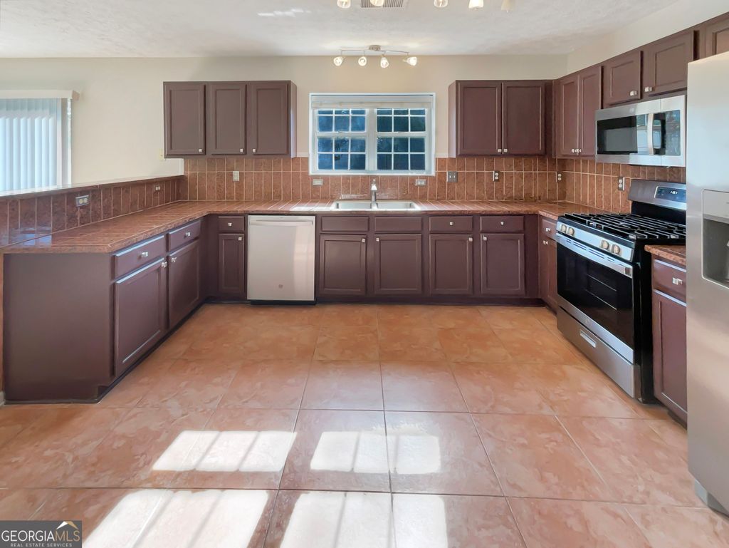 Photo of 3184 Broadleaf Avenue, South Fulton, GA 30349 (MLS # 10658047)