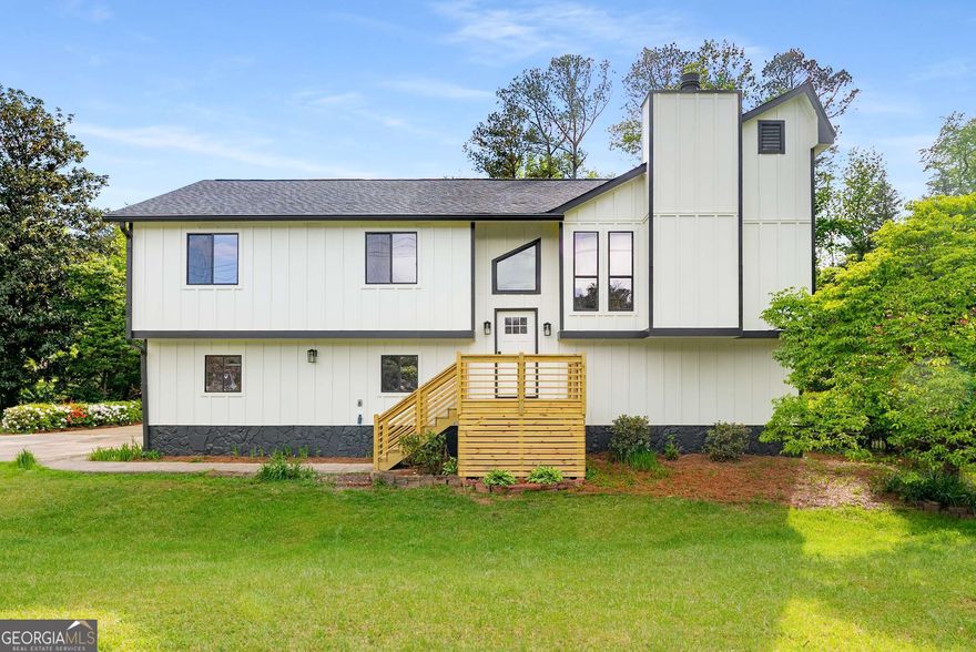 Welcome to 3152 Normandy CircleCoa fully renovated 4-bedroom, 3-bathroom home on a spacious, corner lot in the heart of Marietta. This thoughtfully redesigned residence boasts approximately 2,000 square feet of modern living space, blending elevated design with flexible functionality for todayCOs lifestyle. The upper level features an open-concept living room anchored by a sleek electric fireplace framed in custom wood slats, oversized windows that flood the space with natural light, and wide-plank flooring that flows throughout. The brand-new kitchen is a showstopper, outfitted with crisp white cabinetry, quartz counters, a hexagonal tile backsplash, matte black fixtures, and a generous walk-in pantry. A stylish dining room and spacious bedrooms complete the main floor, including a serene primary suite with a newly renovated ensuite bathroom featuring a tiled walk-in shower and modern single-sink vanity. Downstairs, you'll find incredible flexibility with a second full kitchen, a fourth bedroom, and a third full bathCoperfect for multigenerational living, guests, or a private work-from-home suite. Outside, the home sits on a lush, level lot with a huge backyardCoa true rarity in this areaCoideal for pets, play, or entertaining. The brand-new rear staircase leads to a covered lower patio and flagstone path, while a separate concrete patio offers another private outdoor retreat. Additional highlights include a spacious two-car garage, updated systems, and contemporary lighting throughout. Located near excellent Cobb County schools and just minutes from parks, playgrounds, restaurants, shopping, and the vibrant scene at Marietta Square, this home offers the perfect balance of peace, practicality, and modern comfort. Whether you're looking to settle in, expand, or create a multi-functional lifestyle under one roof, 3052 Normandy Circle delivers it allCobeautifully.
