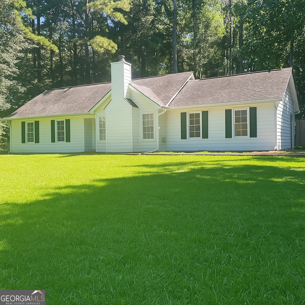 Ranch style home with oversized primary bedroom and huge walk in closet. Additional closet storage too. Eat in kitchen with stainless steel appliances. Two living areas for entertaining. The covered porch overlooks the backyard. Two additional bedrooms and a hall bathroom. Located near restaurants and shopping. Coweta County schools.