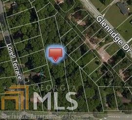 This parcel is being sold as a Buildable lot or Development. Current zoning is R-2. Developers/builders will want to rezone as to maximize lot potential. Acreage on both sides are potential assemblage. Key component of this lot is it contains the city sewer connection.