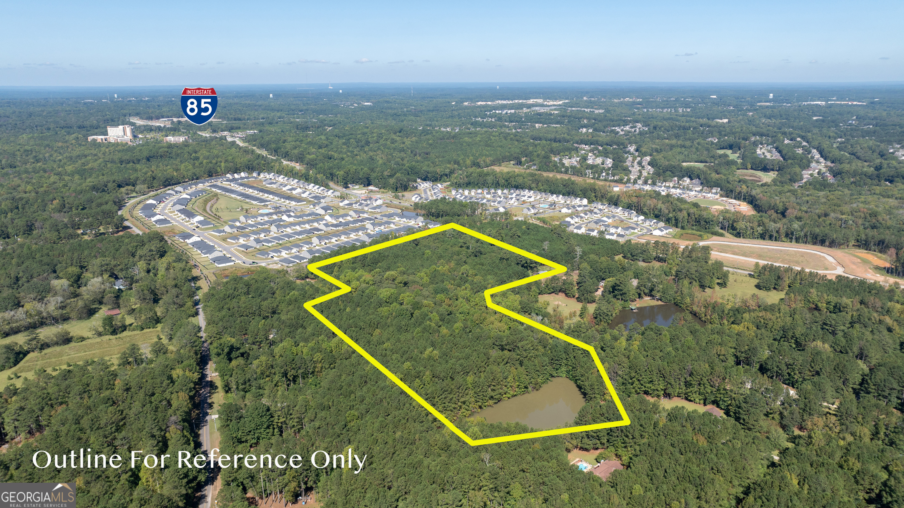 PROPERTY FRONTING ON YEAGER ROAD Just Off Poplar Road With Possible Access Road From Poplar Road.  Approximately 19 acres subject to new survey (Listing Priced at $250,000 per acre.  The exact acreage shall be determined by a new survey to be made at buyer's expense by a licensed Georgia Land Surveyor.  The exact sales price shall be $250,000 per acre for the whole tract.).  Wooded, public water & public sewer available.  Has lake at back portion of property. Zoned C6 (There are certain requirements that property is subject to from the rezoning of said property).  Buyer shall pay for the entrance, any required turn lanes and the entrance road.  All work must be done according to all governmental ordinance, laws, regulations and requirements.  Easy access to I-85 and Piedmont Newnan Hospital.