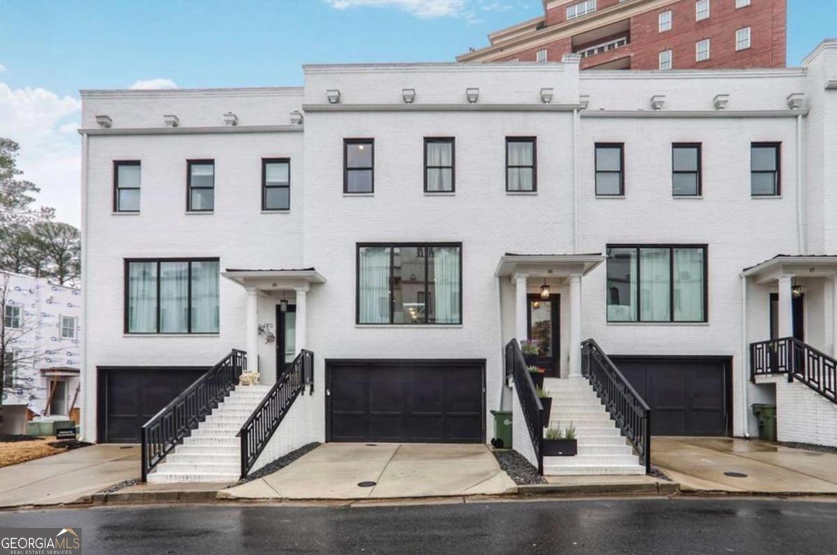 Luxury Buckhead townhome with smart upgrades and custom features. Experience modern living in this stunning 3-bedroom, 3.5-bath residence featuring high-end smart home upgrades, elegant finishes, and custom storage solutions. Located just minutes from Phipps Plaza, Lenox Mall, and top-rated restaurants, this home offers luxury, privacy, and easy access to GA-400 & I-85. Custom California Closets are installed throughout, including his and her closets in the primary suite, a fully customized pantry, and a laundry room with a built-in folding station and hanging area. The gourmet kitchen is illuminated by three pendant lights over the island counter and a chandelier over the dining area, creating a warm and inviting space for entertaining. Each of the three covered porch spaces has been thoughtfully upgraded, including a lower-level walk-out screened-in patio, upgraded tiling on all porch flooring, and a wrought iron fenced backyard. Smart home features like NEST thermostats, a Ring doorbell, and a garage security keypad provide modern convenience and peace of mind. The primary suite features wallpaper accents, two custom California Closet systems, and a spa-like en-suite bathroom with a hightech smart toilet bidet. Don't miss this move-in-ready townhome in the heart of Buckhead!