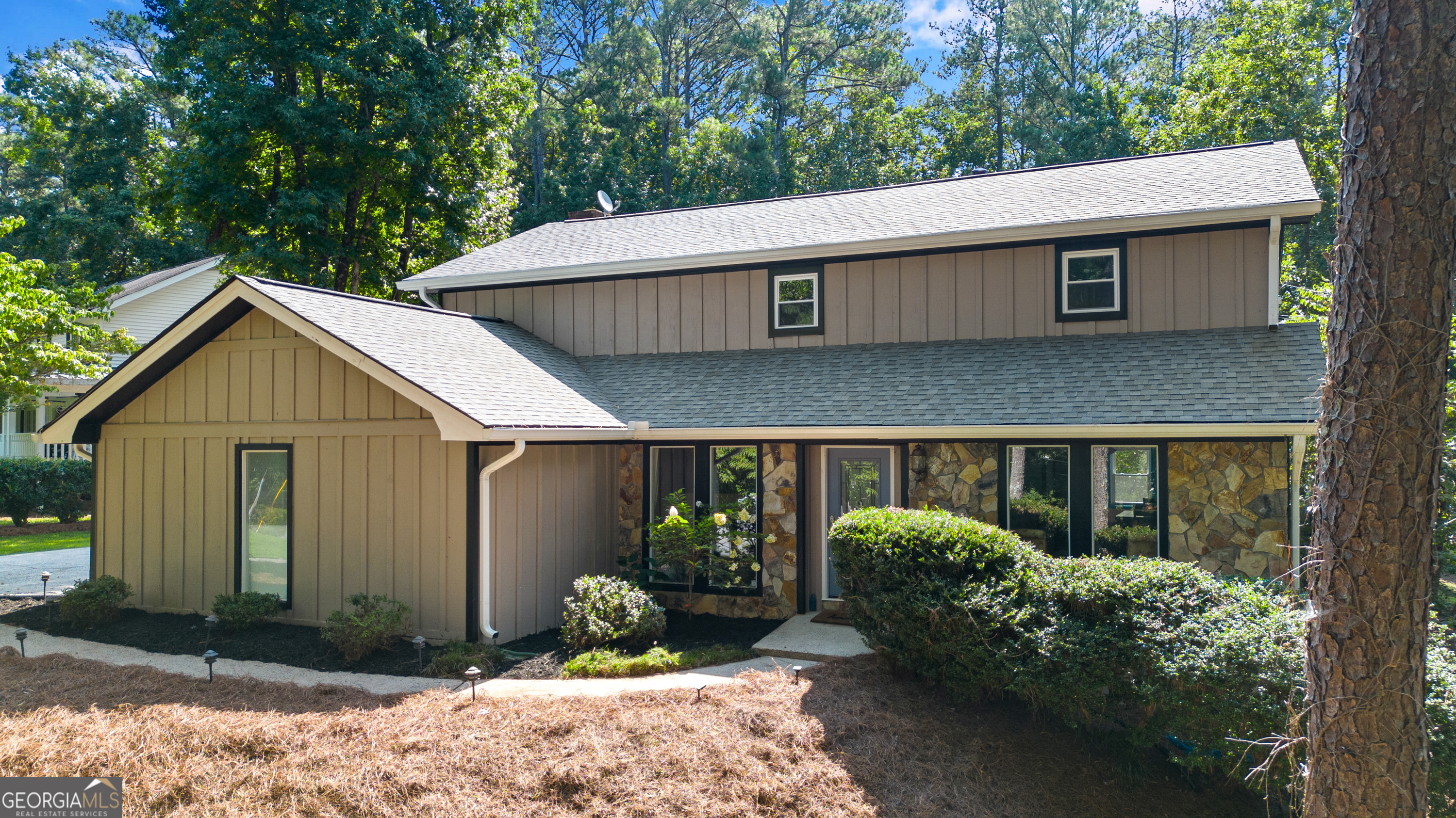 Beautiful home nestled on a large wooded corner lot in delightful Hollyberry:  a highly sought after established neighborhood in Roswell.  Enter the home with a 2-story foyer complete with a quaint nook for favorite houseplants and an eye-catching staircase.  The oversized separate living and dining rooms, separated by an operational set of French doors, flow easily into the kitchen.  The heart of the home is open to the welcoming informal living room with bookcases flanking a stone fireplace. The kitchen featuring all the modern stainless appliances, quartz counters, new wall ovens and slim fit microwave offers a convenient breakfast bar and cozy keeping room to serve friends and guests.  The family room opens to a delightful screen porch with vaulted and beamed ceiling overlooking the private, fenced backyard sanctuary with an in-ground pool and double decks for grilling and relaxing.  There are three bedrooms upstairs with the spacious primary suite separate from the two secondary bedrooms.  Both full baths offer double vanities and separate toilet/shower rooms for extra privacy.  Finished daylight terrace level has a full galley kitchen, a large bedroom and full bath, an additional fireside den or media room, and storage.  This home is well maintained to include new roof and gutters, 2 new HVAC, new water heater, new pool equipment, new attic insulation, replaced pool liner, flooring, new windows throughout, full exterior painting and much more - its just waiting for the next owner's personal touches to make this house a new home.  Ideal central location for all the great downtown shopping and entertainment districts of Roswell, Crabapple/Milton and Alpharetta, North Point Mall, Avalon and Highway 400 access.  Just minutes to the award winning Roswell Area Recreation and Parks and several other Big Creek system trails.  It's no wonder Hollyberry is such a great place to live!!