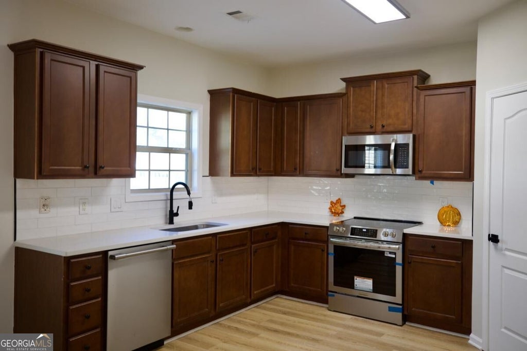Photo of 1919 Trellis View Court, Loganville, GA 30052 (MLS # 10878791)