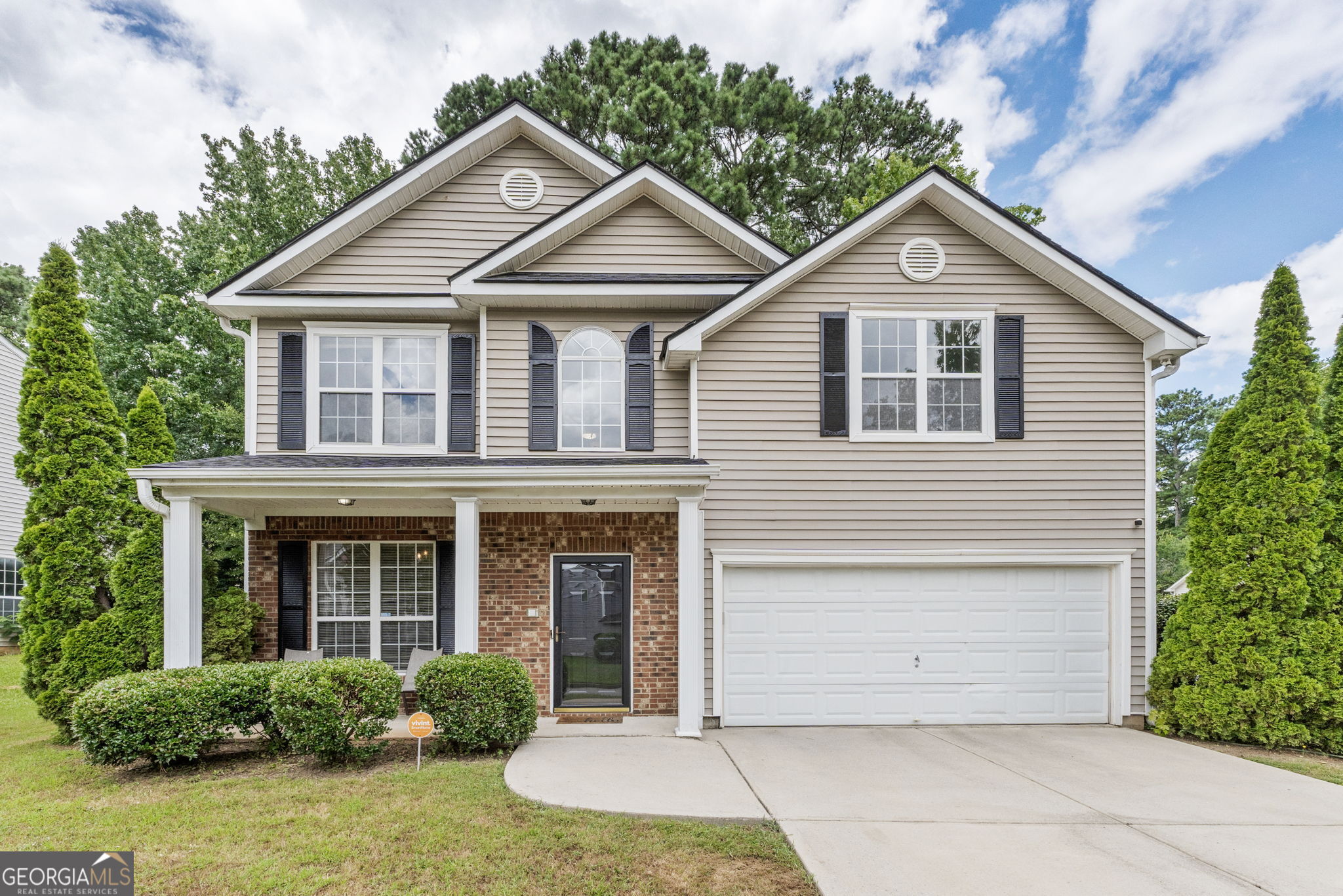 Just listed and recently updated, this move-in-ready home features 3 spacious bedrooms and 2.5 bathrooms with LVP flooring on the main level, fresh interior paint, and updated countertops. The kitchen is equipped with stainless steel appliances and overlooks both the breakfast area and the living room, making it perfect for entertaining. The oversized master suite boasts vaulted ceilings, two separate closets, and a large master bathroom with dual vanities. Additional updates include a recently replaced roof, offering added peace of mind. Conveniently located just a stone's throw from I-20 with quick access to I-285, this home offers both comfort and unbeatable convenience for commuters and city-goers alike. This home would be the perfect first-time home and checks all the boxes.
