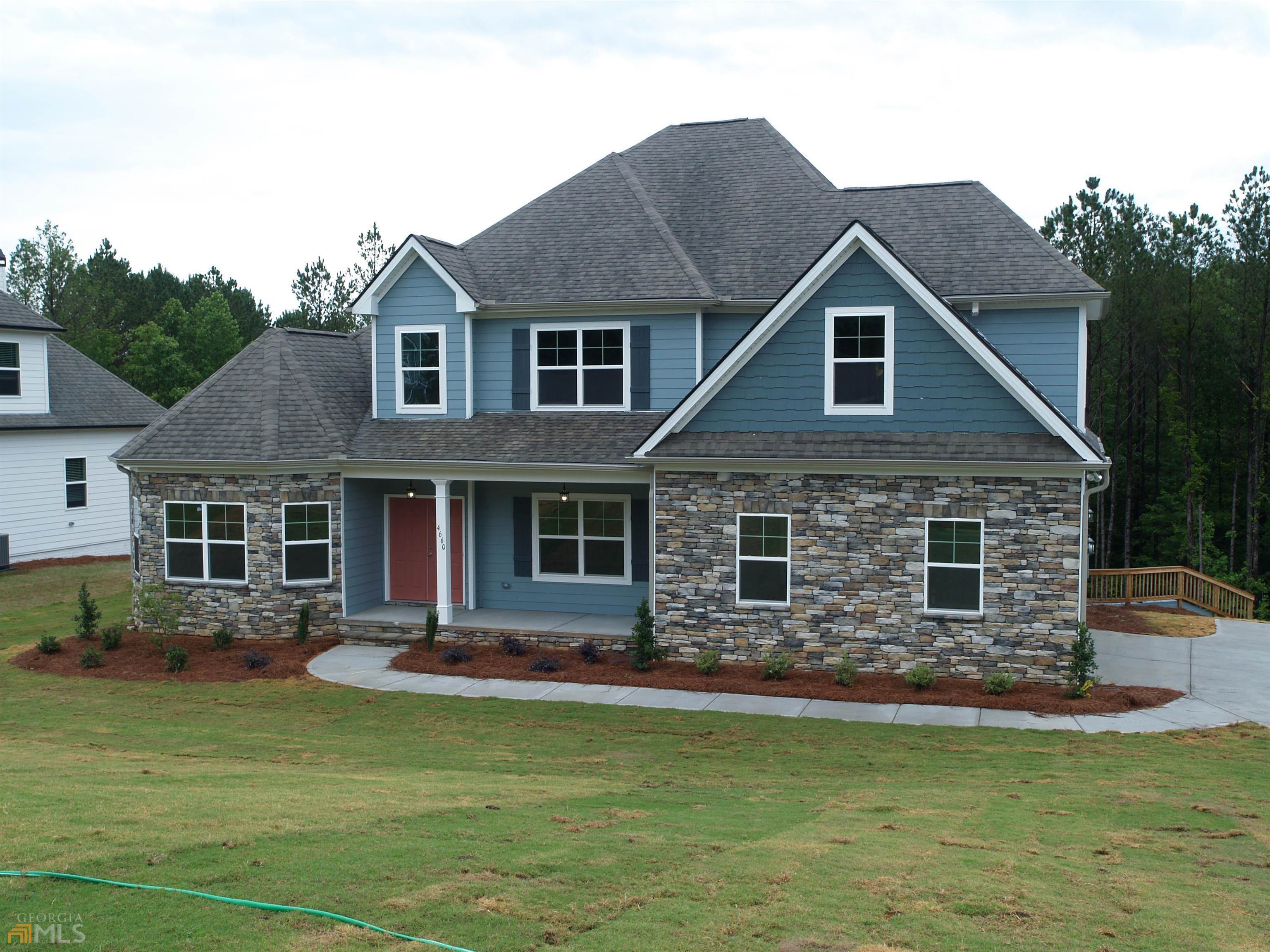 Anderson B 3496 sq. ft. - 4 bd/3.5 ba - Chattahoochee Hills – This RANCH ON A BASEMENT features 9' smooth ceilings on main level, 2-story foyer, open kitchen with raised panel or shaker cabinets/knobs, tile backsplash, large peninsula, granite counter tops, stainless steel appliances, tons of cabinet space that highlight the separate cooktop, built-in wall oven and microwave, and a dramatic, hidden, walk-in chef’s Pantry. The family room offers a view to the kitchen, and wood burning fireplace. The dining room features coffered ceiling and chair rails & shadow boxes. Hardwood floors are standard in the foyer, dining room, & kitchen. Tile floors are standard in the bathrooms and laundry room. The 2nd floor boasts a full suite featuring a living room, bedroom, full bath, and walk-in closet. Owners retreat w/large sitting room & luxurious en-suite features 6 ft. garden tub with tile surround and 5 ft. tiled shower, double vanities, private water closet, huge walk-in wardrobe closet. All this on a basement!