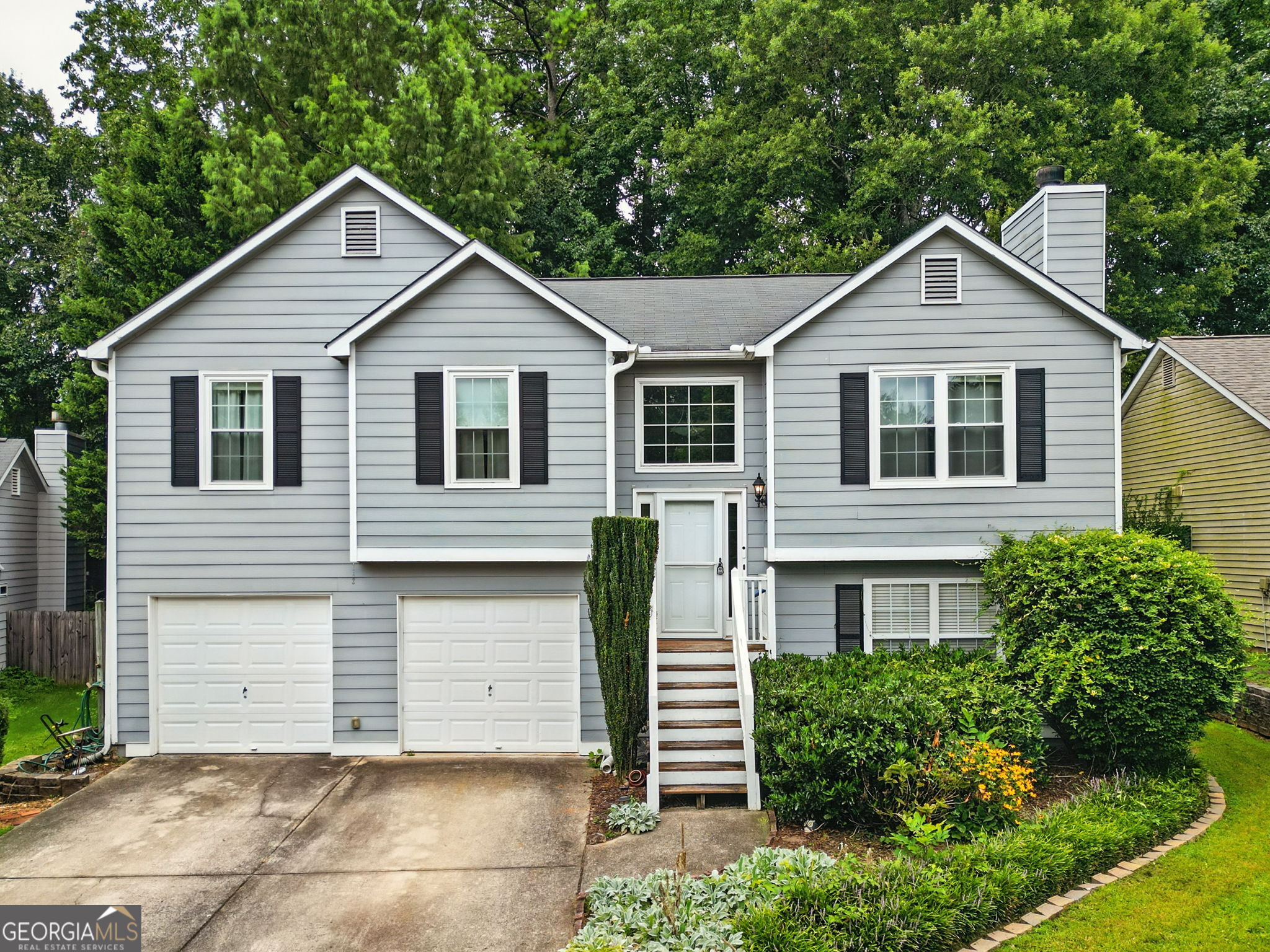 Coming Soon to Market! Split level home located in Lake Park Neighborhood just minutes to downtown Acworth. This 4bed 3bath home offers over 2300 sq ft of living space and a massive lot. The back yard is fully fenced in and landscaped to provide plenty of privacy. A large playhouse in the back yard can be converted into a workshop or shed. There is also a back deck, perfect for grilling out or relaxing with friends or family. Inside, the main level of the home has an open concept living room to kitchen with stainless steel appliances. Three beds and 2 bath are located on the main floor as well. Downstairs, one more bedroom and bathroom can be found as well as flex space that can be used as a home office or gym. Two car garage with ample space for parking as well as garage storage. Brand new HVAC installed as of August 2025 and Brand New Roof being installed the week of August 18th. This HOA neighborhood offers swim, tennis and community pond.
