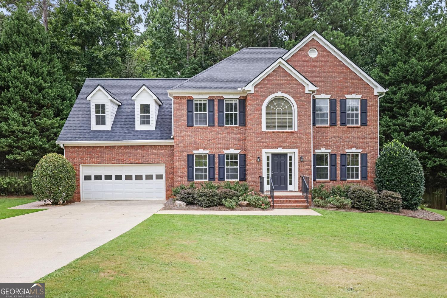 Welcome to this beautifully landscaped 4 bedroom home that sits on .429 acres. The front door opens to a 2 story foyer and an open floor plan with lots of windows. Just inside is a formal dining room and living room (that could be used as an office). The kitchen opens to the eat in kitchen and family room with a fireplace. The laundry room is conveniently located on the first floor off the kitchen. Upstairs the owner's suite has tray ceilings, a sitting room and a fireplace. The owner has made the following improvements since owning the home: microwave, dishwasher, deck, water heater, HVACs and roof. The fenced backyard is a peaceful oasis to enjoy nature. Schools: Pickett's Mill, Durham, and Allatoona. Convenient to shopping and restaurants.