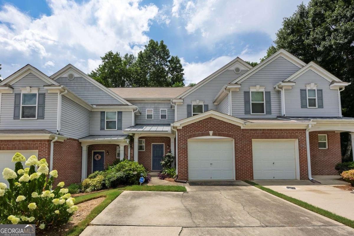 Nestled in the desirable Milstead Place neighborhood, this well-maintained 2-story townhome is a true find! Featuring updated flooring, elegant granite countertops, it offers a modern and inviting atmosphere. Enjoy a low-maintenance lifestyle with HOA fees that cover essential services such as roof repairs, gutter cleaning, and retention pond maintenance. Located just a short walk from popular shopping and dining, everything you need is within reach. With a perfect balance of convenience, style, and community, this home is an exceptional opportunity you won't want to miss!