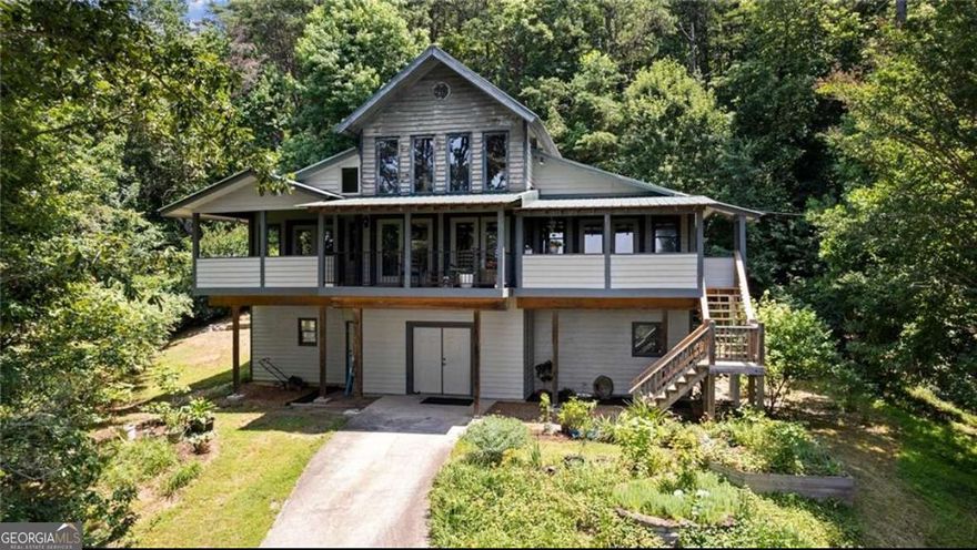 Nestled on 5.82 private acres along the side of Yonah Mountain between Cleveland and Helen, this beautiful home blends rustic charm with modern comfort, featuring 3 bedrooms and 3 bathrooms. Step inside from the porch where the mountain views are breathtaking and you'll be greeted by soaring ceilings and a cozy loft above. Relax in the inviting living room with a good book or your favorite show, or gather in the warm, welcoming kitchen with solid-surface countertops, stained cabinets, and a casual eat-in area overlooking the living space. Both main-level bedrooms are generously sized, each with its own ensuite bathroom, large closet, and direct access to the front porch. The lower level offers an additional bedroom, bathroom, and a secondary living area, perfect for guests or extra space to spread out. Outside, enjoy the peaceful setting with a back porch, two fire pit areas, and several storage sheds. With its breathtaking views of the North Georgia Mountains, this property is truly a mountain retreat you won't want to miss. Schedule your showing today! *Additional pictures coming soon*