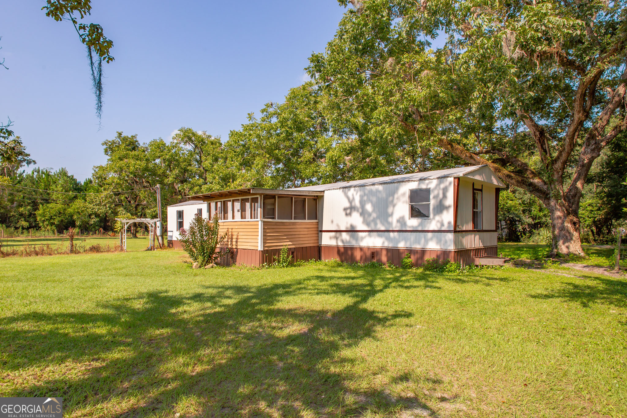 This 3-bedroom, 1.5-bath mobile home offers the charm of country living with some modern updates already in place. Fresh paint, new flooring, and brand-new appliances inside pair perfectly with a new A/C system for comfort year-round. Step outside to a large, lush yard that provides the perfect setting for gardening, outdoor gatherings, or simply enjoying the peaceful surroundings. With space to stretch out and breathe, this property is a great opportunity to enjoy quiet affordable living with convenience close by.