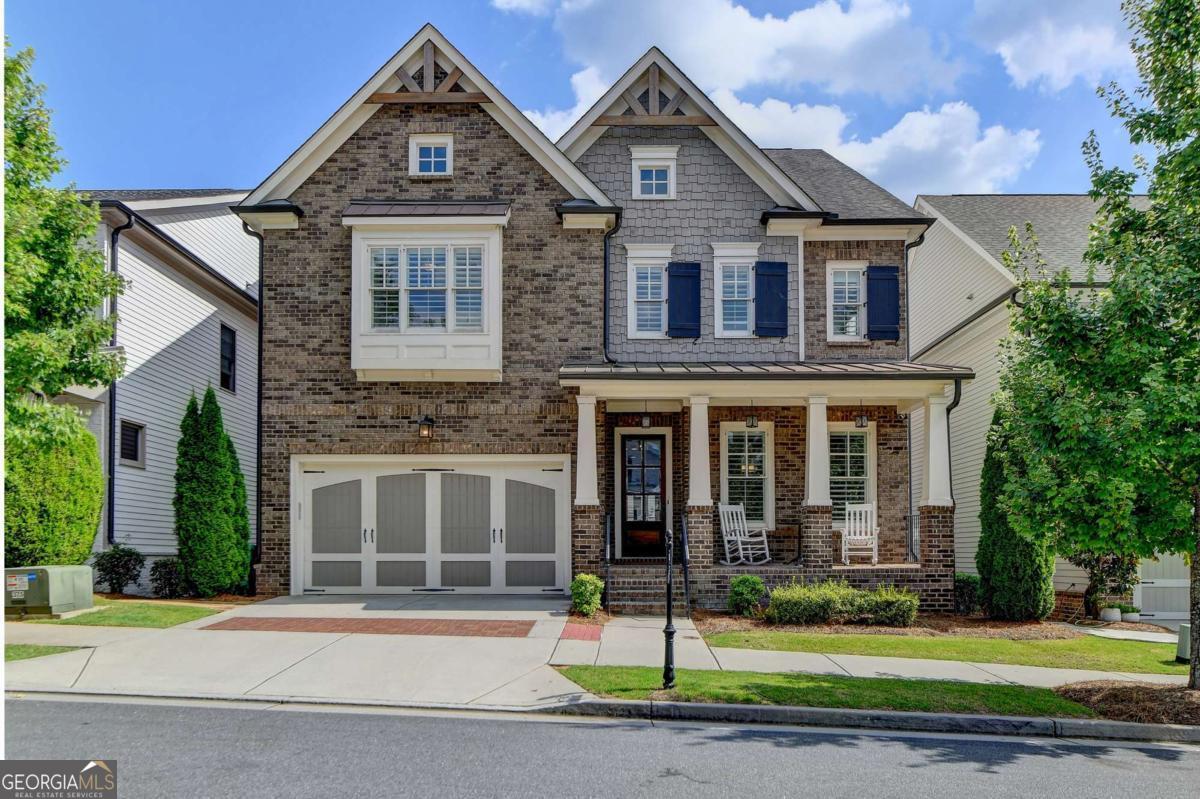 Welcome to this Beautiful home located in the prestigious, award-winning gated community of Bellmoore Park, nestled in the heart of Johns Creek and zoned for the highly acclaimed Northview High School. This home features the coveted "Montgomery" floor plan, boasting seven spacious bedrooms and six full bathrooms, including a fully finished basement-all meticulously maintained and in excellent condition. A brick-and-stone front porch ,Is a quiet place for you to sit and sip your morning coffee to begin your day. As you step into the entrance foyer, you're immediately welcomed by open-concept layout and modern design ,and soaring 10-foot ceiling on the main level that enhance the sense of space and elegance. Formal dining room- perfect for hosting family meals or special occasions. Spacious gourmet kitchen equipped with a gas cooktop, double oven, granite countertops, white cabinetry, and an oversized center island, perfect for both everyday living and entertaining. Elegant hardwood flooring runs throughout the main level, enhancing the overall warmth and sophistication of the space. Huge family room with cozy fireplace and plenty of daylight. The main level includes a guest bedroom or flexible space with a full bathroom. Upstairs, you'll find four bedrooms and three full bathrooms include luxurious owner's suite complete with a soaking tub, frameless glass shower, double vanities, and his-and-her walk-in closets. Two additional bedrooms share a full bath with a double vanity, and another private bedroom suite includes its own full bathroom. A spacious laundry room with a utility sink and walk-in storage closet adds to the home's convenience. The beautifully finished basement feels like an extension of the main living space, featuring a large living area with a gas fireplace and custom built-ins, a bar with granite countertops and tile backsplash, a private guest bedroom with full bath, and a full-size exercise room with direct access to the extended patio and fenced backyard. Community amenities include two resort-style swimming pools, a clubhouse, state-of-the-art fitness center, tennis courts, basketball court, playground, and a scenic grand lawn. With HOA-maintained lawn care, top-rated schools, luxury amenities, and superior craftsmanship, this is truly the dream home that offers everything you could want and more. Don't miss out on this incredible opportunity to own a move-in ready home in one of Johns Creek's most sought-after communities.