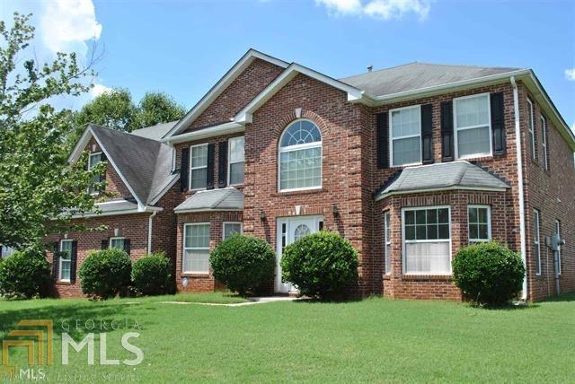 Beautiful 5 bedrooms, 3 bath home. It has a large living and dining room. It has a kitchen with SS appliances. There is a breakfast area that over looks a large den with fireplace. This home offers a 2 story foyer and 9 foot ceilings. There is a bedroom and full bath on the main level. The other 4 bedrooms are up with 2 baths. The master bedroom is very large with sitting area. The master bath has a garden tub, his and her sinks, separate shower and large walk in closet. The neighborhood offers a pool, sidewalks and street lights. The home is located on a corner level lot.