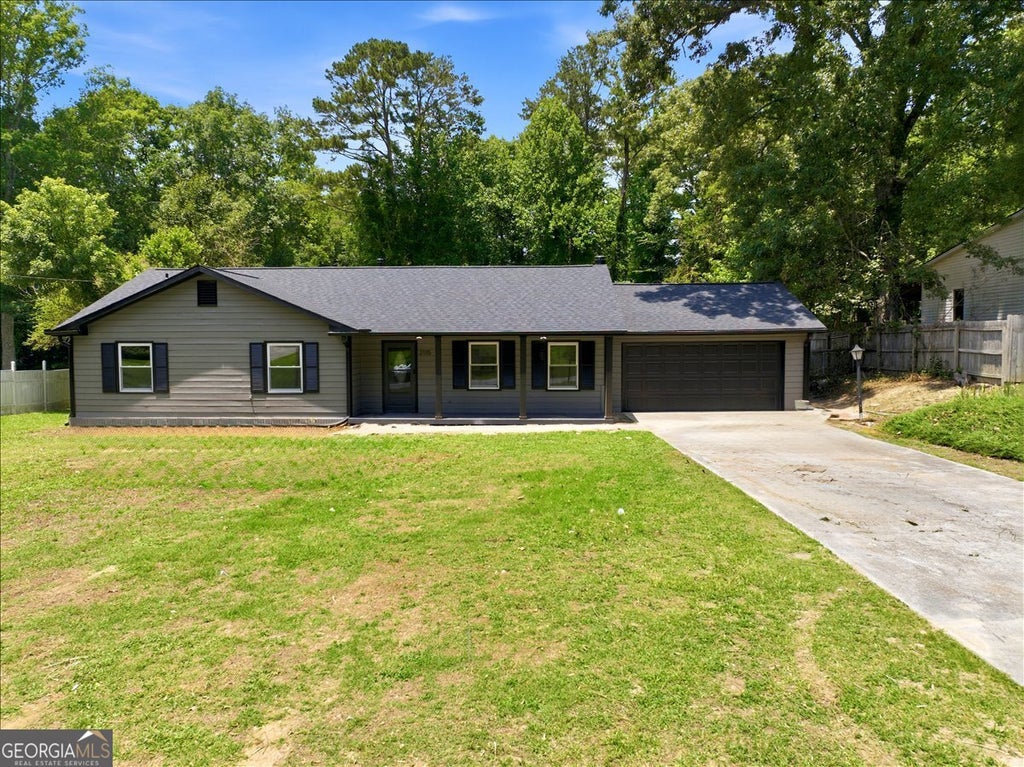 Photo of 2115 Lost Forest Lane SW, Conyers, GA 30094 (MLS # 10784298)