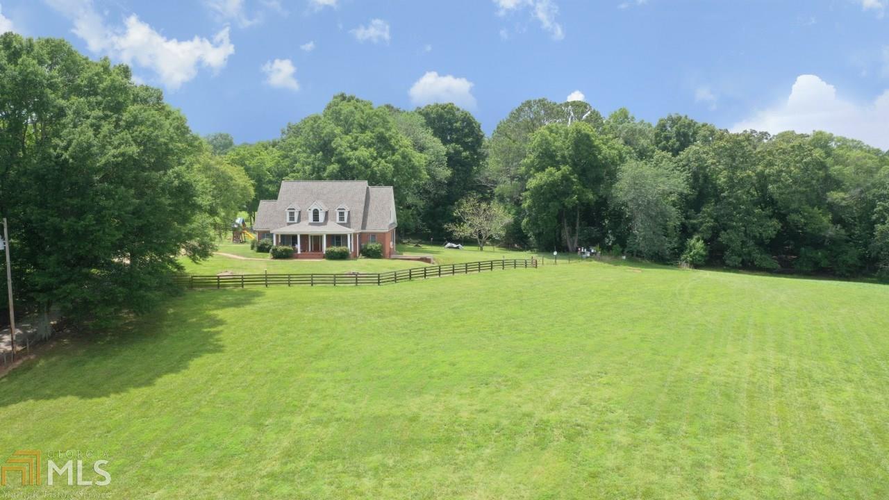 50 +/- acres in a prime Milton location. Close to the Avalon, downtown Alpharetta, and 400. The property has rolling green pastures, a beautiful homesite, and 4 board fencing which offers multiple possibilities - build your dream home or development opportunity (site plan is available). Additional acreage is, also, available - call agent for details.
