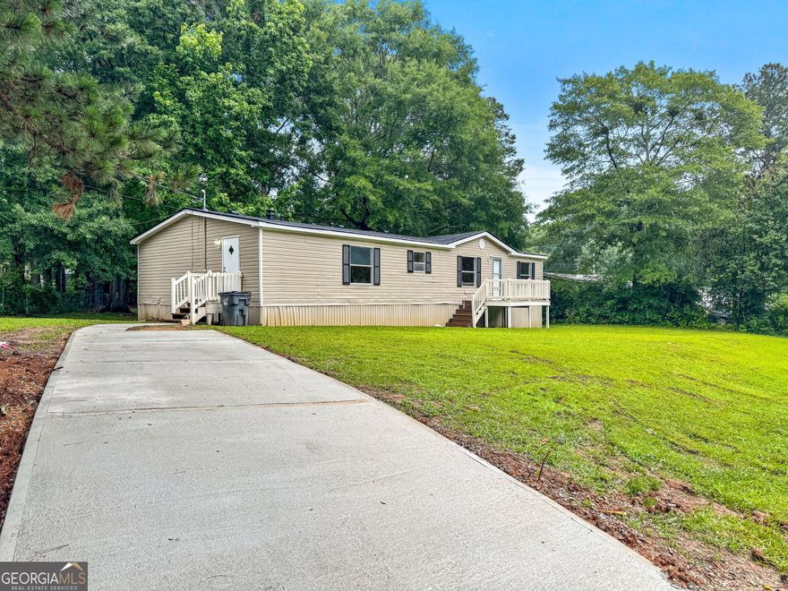 "THE CHANCE SELLS TEAM" presents to you a spacious and very roomy house for the price! This home has been remodeled. New kitchen counter tops, back splash, new paint and new flooring throughout. New roof, new driveway & sidewalk and new HVAC system too. All of the new items have been installed and updated in the last 2 weeks. This one is very nice and move in ready!! This is a lake community as well. This 3 bedroom 2 bath split bedroom plan has a very spacious kitchen open to the large Great room. Nice primary suite and the second bedrooms are a very good size too.  Large great room with a fireplace. Nice sized primary suite with walk-in-closet, shower/bath area too. The land and home are both included in the sale of this property, incase you were wondering. Give us a call for your easy viewing of this nice home and property today! Thanks, Chance.