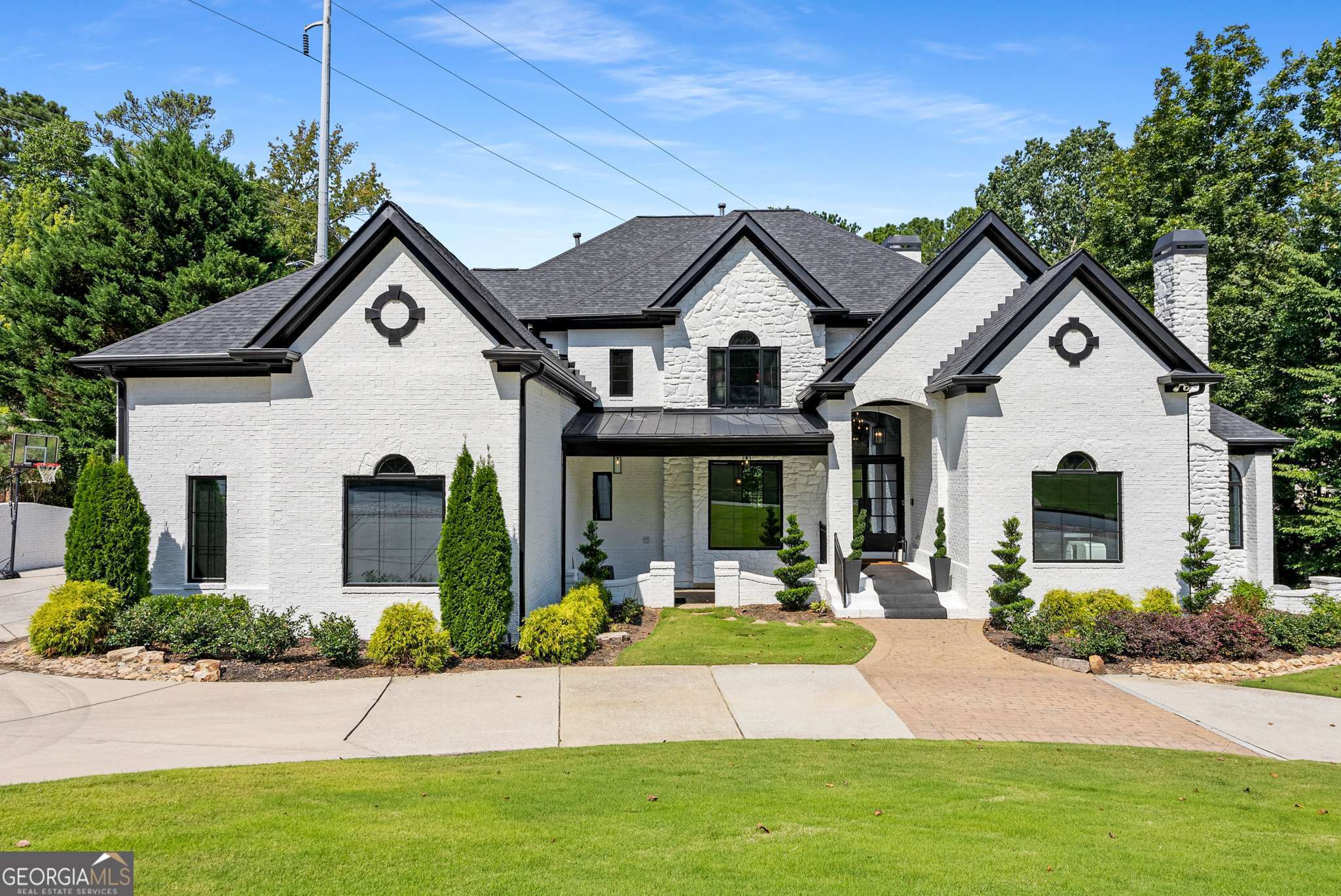 Step into luxury living at 4505 Bastion Dr, perfectly situated in one of the area's most sought-after neighborhoods, featuring a top-rated school district, community pool, and tennis courts. This exceptional home has been thoughtfully upgraded from top to bottom, blending modern elegance with smart-home convenience to deliver truly move-in-ready living. Enjoy modern comfort and peace of mind with soundproof windows installed in 2022, a brand-new roof completed in 2023, and upgraded metal exterior doors plus new interior doors added in 2022 for enhanced security and style. Inside, new flooring throughout creates a cohesive, fresh look, while the chef's kitchen and spacious family room provide the perfect space for entertaining or everyday living. The outdoor areas are just as impressive, featuring a fully enclosed, upgraded patio, a new Trex deck, and an electric retractable screen-ideal for year-round enjoyment. Electric blinds throughout the home add a layer of effortless luxury. This home is equipped with state-of-the-art smart home technology, including a Sonos surround sound system installed both indoors and outdoors, a Lutron smart lighting system, app-controlled thermostats, and an upgraded, app-controlled irrigation system. Stay secure with Ring security cameras and keyless entry on all exterior doors. Fast, reliable AT&T Fiber internet ensures seamless connectivity for work and streaming. Additional thoughtful upgrades include heated basement toilets, a new water heater (2024), and a whole-house water filtration system (2024)-adding comfort and functionality to every level of the home. Located in the highly desirable Lassiter High School district, and zoned for Garrison Mill Elementary and Mabry Middle School, this home combines location, lifestyle, and luxury in one incredible package. Don't miss your chance to own this beautifully upgraded, turn-key home in a premier East Cobb community.