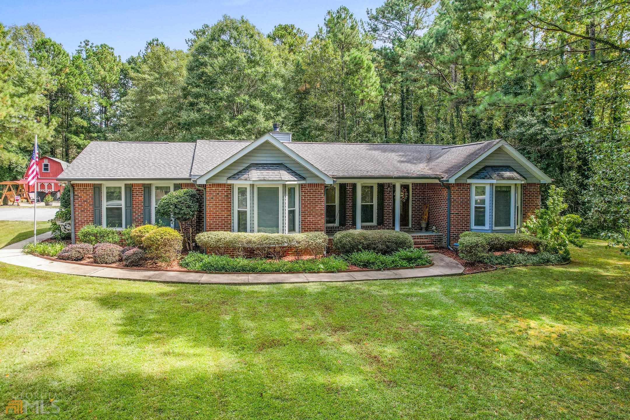 Don't miss out on this home in the sought-after Ola Community. This 4-sided brick ranch has a 3 bedroom split floor plan with a large master with a bay window, updated master bath, also with bay window, and with walk-in closet. The oversized secondary rooms share a bath that's also updated. Enjoy your open eat-in kitchen boasting your 3rd bay window. It has newer granite countertops and appliances all just two years old. The kitchen flooring is LVP and is also only two years old. The adjacent dining room is sized for a large family. The family room has vaulted ceiling and a pellet burning insert in the fireplace. The bright and roomy laundry is one to see. A extra large den compliments family time in the evenings. The home lets in natural light all around with 24 Window World windows, most of them floor length. But wait, there's more..... Just steps out the door and you will enjoy the outdoor life in the 20x20 grilling and chilling area. Also has a fenced backyard for all your fur babies. Enjoy your privacy on this 1.59-acre partially wooded lot. Whether it the inside or out, you do not want to wait to tour this home. It will not last long! Schedule your showing today. SHOWN BY APPOINTMENT ONLY. **AGENT OWNED**