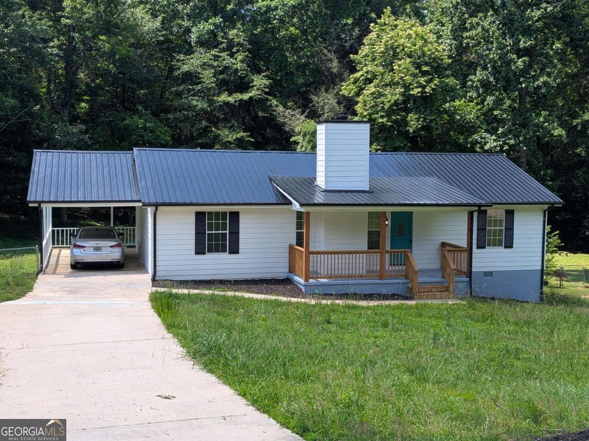 Beautifully renovated ranch home on spacious 1-acre lot. New flooring, new stainless steel appliances, new light fixtures and new front porch and back deck railings. Remodeled bathrooms. Freshly painted inside and out! The updared kitchen opens up into the living room with a wood-burning fireplace. level back yard is completely fenced in.