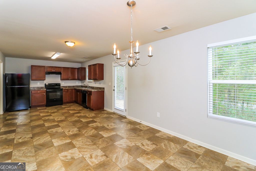 Photo of 7103 Tanger Boulevard, Riverdale, GA 30296 (MLS # 10729180)