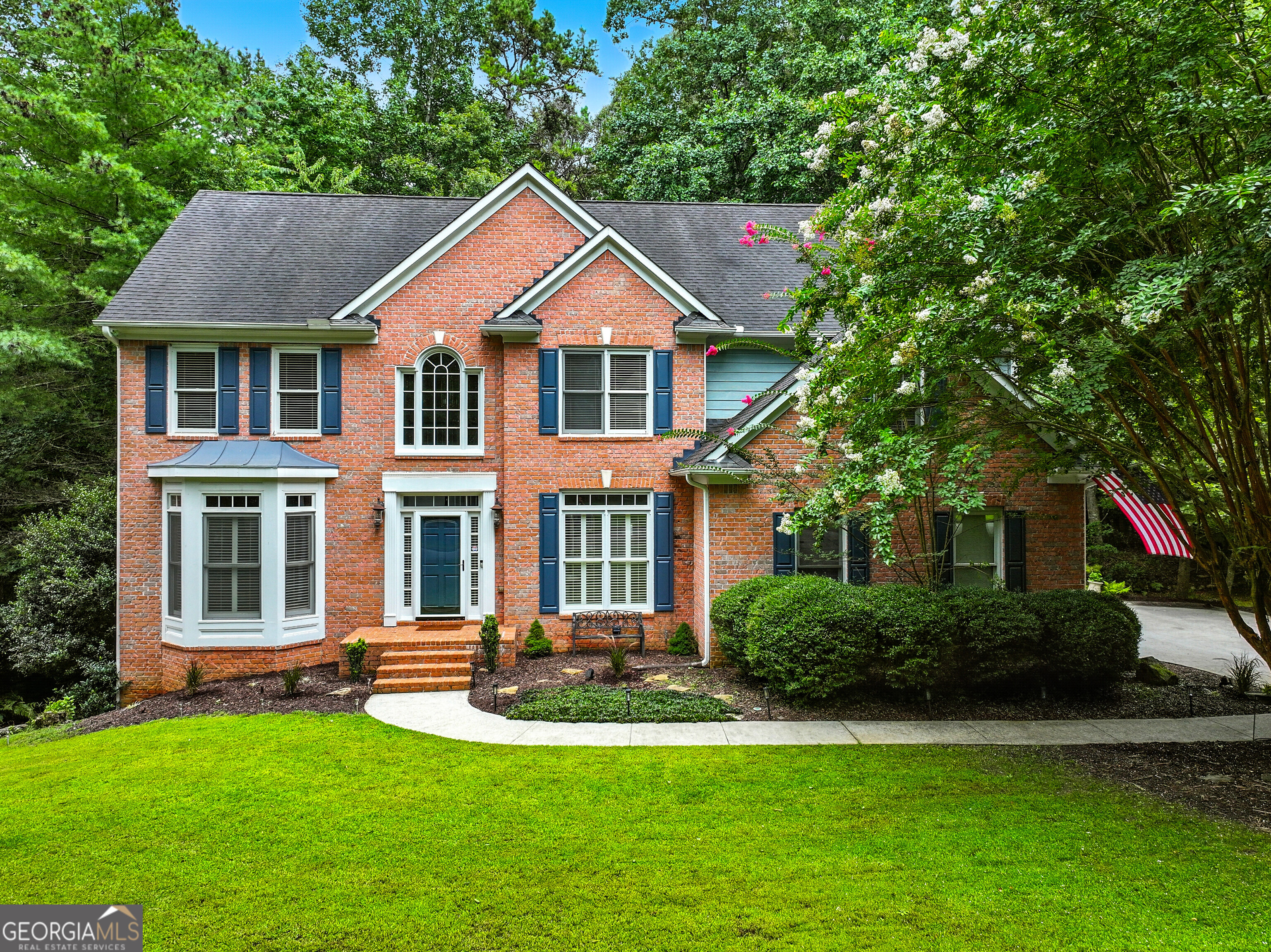 Beautiful 3-Sided Brick Home located in the highly sought-after Grand Cascades neighborhood-one of Suwanee's premier communities-enjoy resort-style amenities including two pools (zero-entry and Jr. Olympic), a beautiful clubhouse, fitness center, six lighted tennis courts, pickleball, a playground, a basketball court, outdoor sand volleyball court, and two fish stocked lakes. Play baseball and soccer on the sport fields or fly a kite on a breezy afternoon all while hearing the wonderful sounds of nature throughout the neighborhood. A favorite family pastime is meandering along side the Chattahoochee River on miles of shaded walking trails!!! A little slice of Heaven while still being close to Northside Hospital and upscale shopping. This stunning 4-bedroom, 3.5-bath home is in walking distance to the amenities and features three finished levels, all nestled on an oversized lot in a park like setting. Step inside to an inviting two-story foyer which leads to the kitchen and opens to a Two-story family room featuring a brick fireplace with built-in shelves-perfect for cozy evenings or entertaining. Enjoy cool fall days on the screened porch overlooking a huge, private backyard. The deck also includes an outdoor grilling area that wraps around to the driveway for easy access. The finished daylight basement includes walk-out access to the backyard, a fire pit area for even more room to relax or entertain. Seller is offering an allowance for fresh paint, flooring and updated kitchen appliances depending on the offer price. All of this, in the top-rated Lambert High School district.