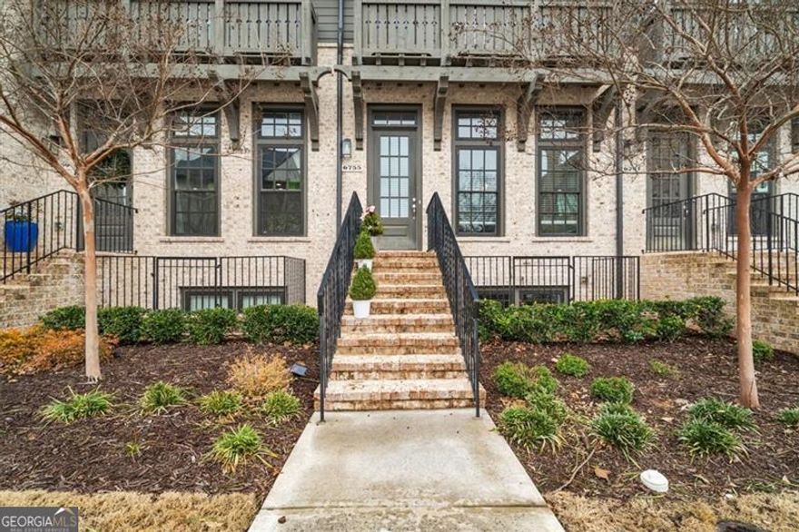 Welcome home to this modern like-new townhome nestled in a highly desirable Aria subdivision in the heart of Sandy Springs !This three-story home features open floor plan with dining room that offers lots of natural light. Modern Chef's kitchen with oversized island, gas cooktop, quartz counter tops ,beautiful backsplash and stainless appliances. Spacious living room with fireplace and hardwood floors throughout main level. Step outside to a private balcony overlooking wooded area. Main floor flows beautifully a perfect space for entertaining or hanging out with your family. Upstairs you will find a spacious master bedroom with sitting area, a luxurious bath with floor to ceiling tile and a walk-in closet. Additional bedroom with a private bath. Basement offers large bedroom a full bath and additional closet for storage. New carpet! Situated on a desirable lot that offers beautiful and private wooded area perfect for relaxation or entertaining! Two car garage and plenty of additional guest parking lots throughout the community. Aria extends an array of amenities, including two pools, a Clubhouse, a Fitness Center, a Club Room, and a 12-acre park nestled within the community. Dining and shopping options just a short stroll away in Aria Village, right across the street! Convenience is the key and this luxurious subdivision offers that and more all within this gorgeous community! Minutes from GA 400 and Marta station. A MUST SEE!!!