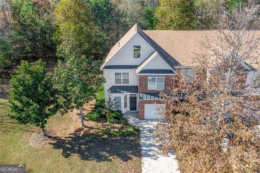 Welcome to 374 Saint Claire Drive, an end-unit townhome located in the desirable Saint Claire community in Alpharetta. This spacious 4-bedroom, 2.5-bathroom home offers 2,090 sq ft of thoughtfully designed living space, featuring newer hardwood floors on the main level, tile flooring in the sunroom, and brand-new carpet upstairs. The updated kitchen includes stained cabinets, a pantry with a spice rack, solid surface countertops, and newer appliances including a refrigerator, gas range, microwave, dishwasher, and disposal. Enjoy a cozy living area with a fireplace, a separate dining room, and a one-car garage with a long driveway for ample parking. The primary suite features a double vanity, soaking tub, and separate shower. Freshly painted throughout, this home is located just minutes from Halcyon, The Collection at Forsyth, the Big Creek Greenway, and parks. Zoned for top-rated Denmark High School, the community offers amenities such as tennis courts and a swim team, making it ideal for active lifestyles
