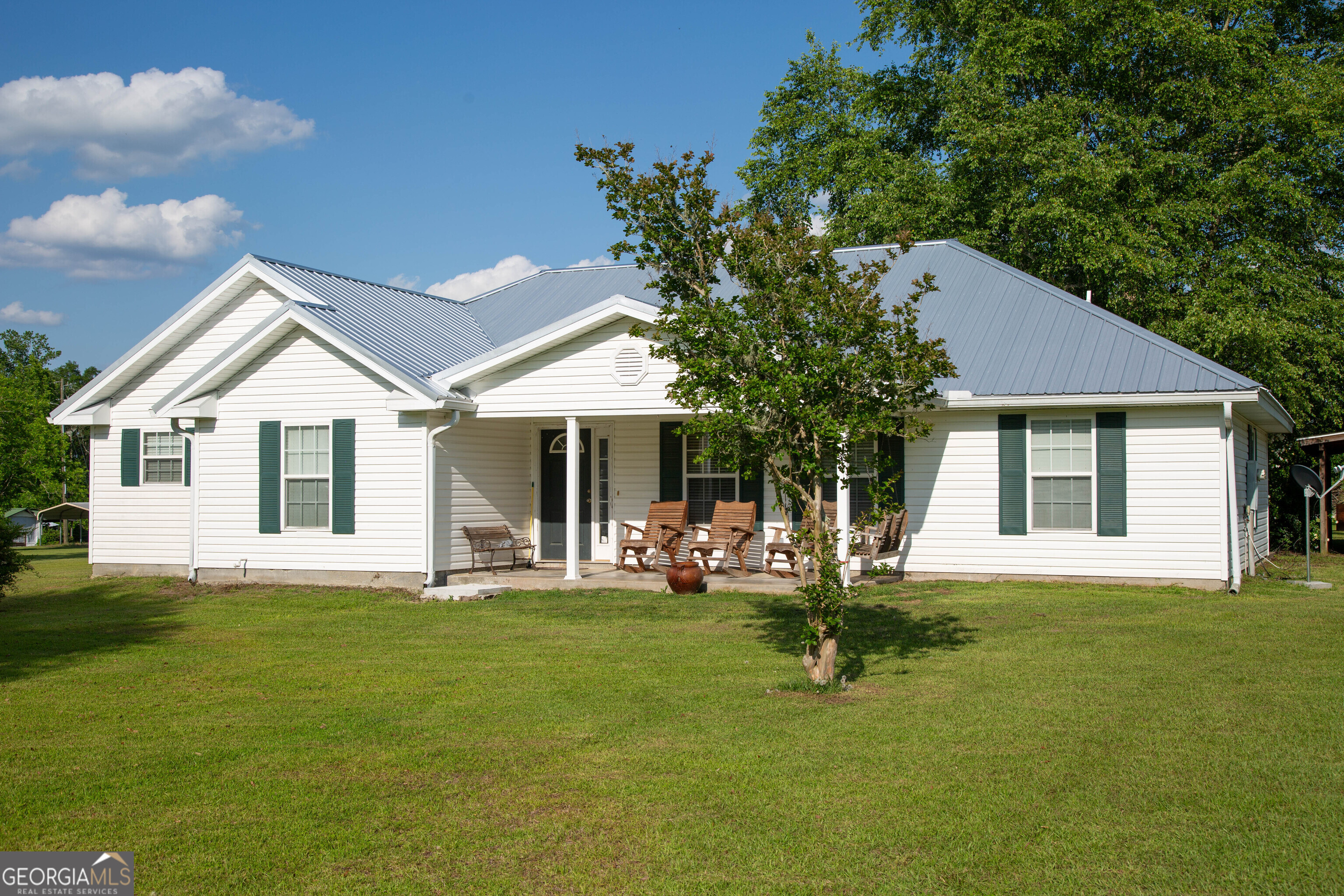 *$5,000 in seller concessions**NEW Roof and HVAC* Enjoy views of a nearby citrus grove and soak in peaceful living at this well-appointed Wayne County property. Take the VIRTUAL TOUR and explore the ample living space, sun room, spacious kitchen, and all the comfort that the primary suite and two additional bedrooms and full and half bath have to offer. With a new roof, AC, and stainless steel appliances, this home is primed for low-maintenance living. Situated on 1.83 acres in a convenient location for commuting to Jesup and the surrounding counties, this property provides access to local amenities with the charm of a rural setting. Storage abounds in the finished shop with concrete floors, roll up door, and covered parking. Schedule your showing today to see all that this property has to offer.