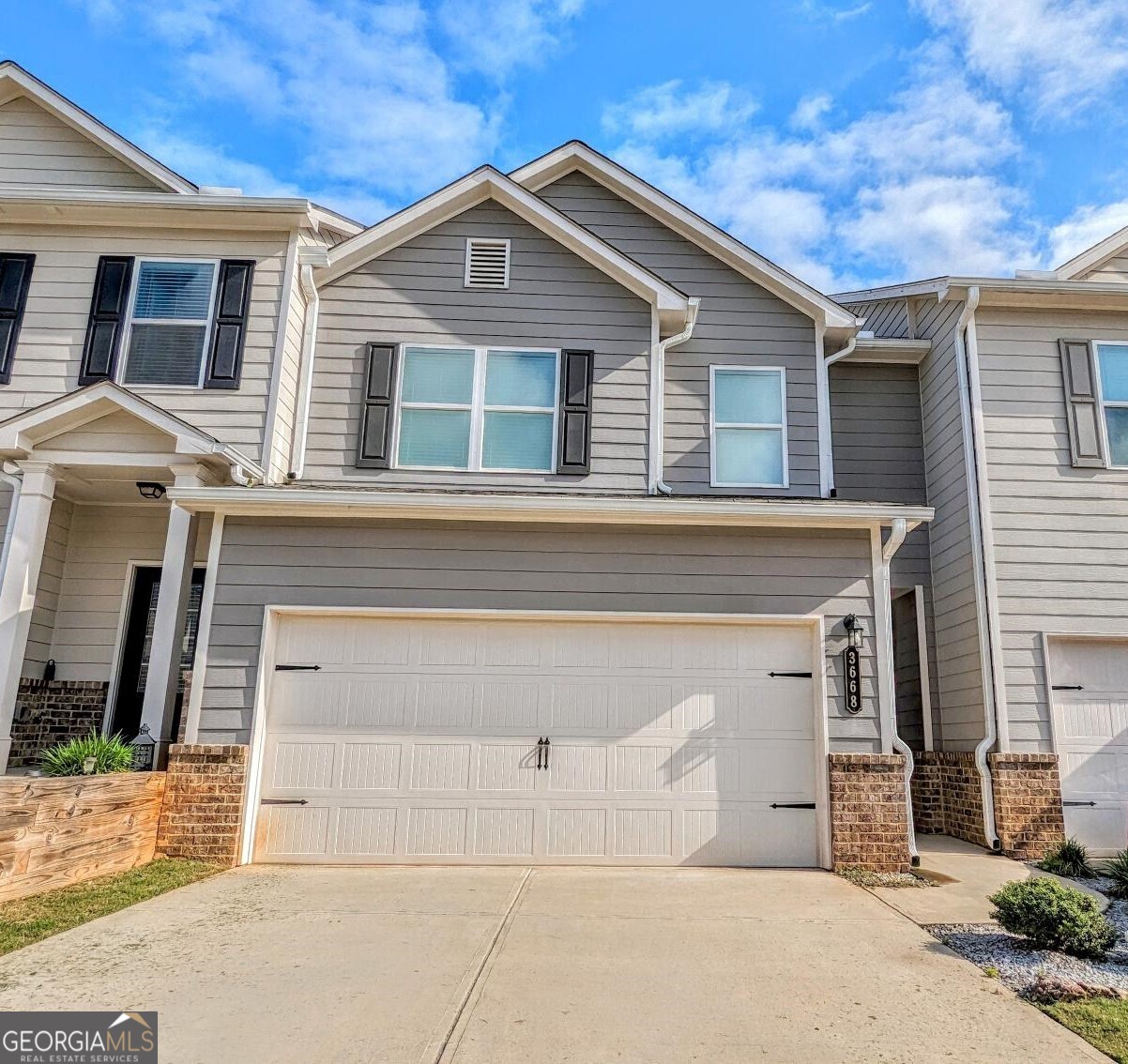 Available in August! Welcome to this well maintained 3 bedroom, 2.5 bathroom home in the conveniently located neighborhood of The Reserve @ Oak Station in Oakwood, GA. Close to 985, UNG, and local parks, this newly listed rental property boasts an open floorplan with hardwood floors on the main level, an electric fireplace in the spacious living room, large flatscreen with soundbar, and a rear patio for outdoor entertaining and grilling. The kitchen has granite countertops and all stainless appliances. Upstairs, you'll find 2 guest bedrooms with walk-in closets, a full guest bathroom, and a large master bedroom with vaulted ceilings. The master bathroom features a tiled shower, separate tub, and double vanity. Off the master bathroom, and accessible from the hallway, you will find the upstairs laundry room with a washer and dryer included. 2 car garage for parking. Don't miss out on this opportunity to lease a beautiful home with landscaping included in a prime location. No Pets Allowed Please check or website for details and our rental criteria