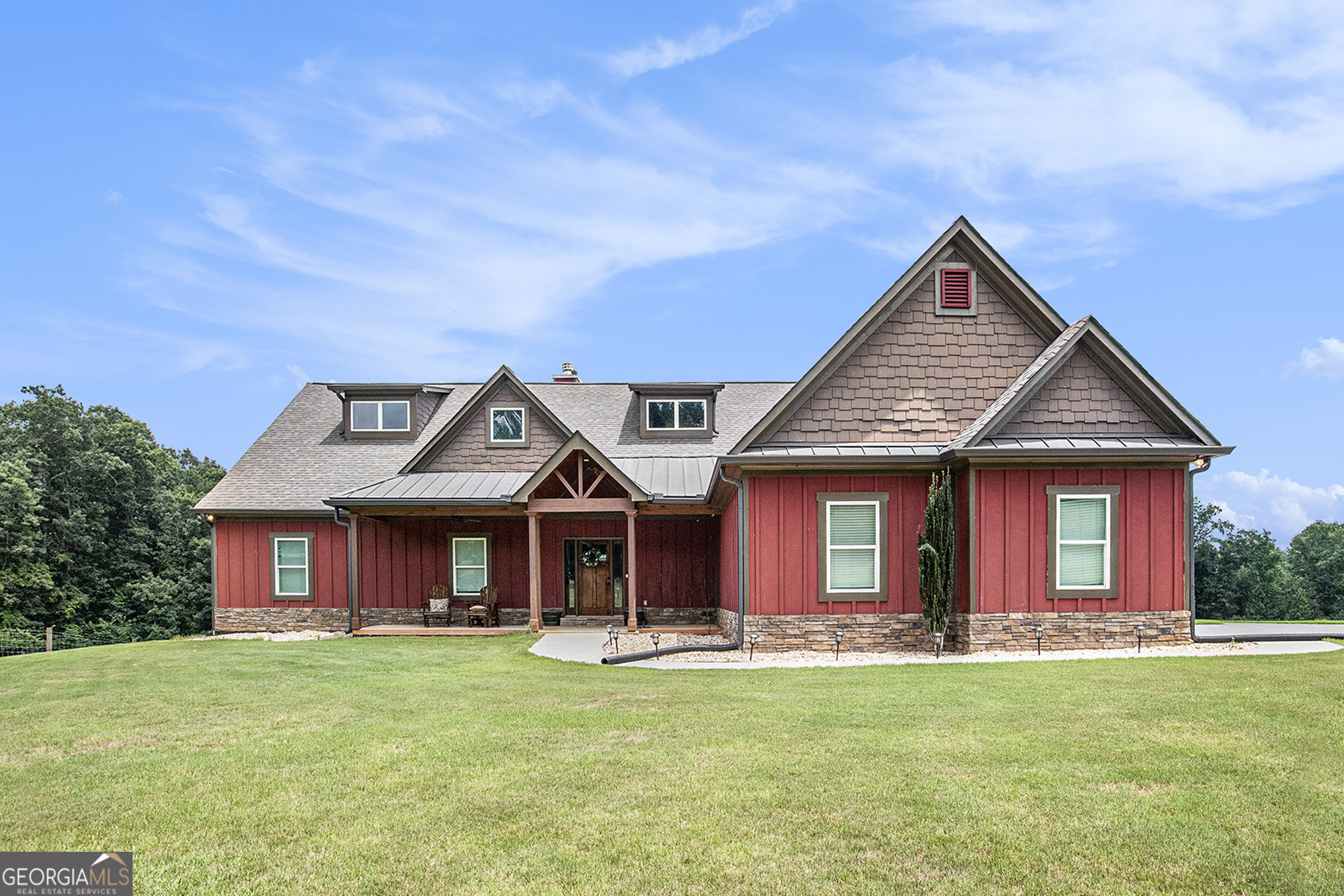Welcome to your dream retreat, where farmhouse living meets modern elegance. Nestled on nearly 7 picturesque acres, this stunning property offers captivating views of a beautiful wooded area, providing a serene backdrop for your everyday life. As you enter the home, you'll be captivated by the exquisite design that showcases special touches like shiplap walls, exposed beams, and rich wood countertops. The farmhouse-style kitchen seamlessly connects to the great room, featuring vaulted ceilings and a cozy fireplace perfect for gatherings or quiet evenings. Step outside to discover your private outdoor oasis. An exquisite saltwater Gunite pool awaits, surrounded by a spacious patio and hosting area ideal for summer barbecues or simply soaking in the sun while enjoying the picturesque views. This remarkable property includes a pole barn for your equipment and two detached garages, with the largest being insulated and equipped with electricity. Whether you're looking for storage, workspace, or hobby areas, the possibilities are endless. Enjoy your morning coffee on the back deck, taking in the lovely views of the wooded landscape. The peace and tranquility of nature surround you, making it easy to unwind. Venture down to the fully equipped basement, which features a complete kitchen, laundry area, living room, two bedrooms and separate driveway. This versatile space offers potential for guest accommodations or rental income, providing even more value to this incredible home. With an array of exceptional features and amenities, this farmhouse retreat is a must-see. Don't miss your opportunity to embrace the charm and tranquility of this exquisite property. Call or text RU4 Homes Team for a private showing today! Move Up to Any One of Our Listings, We'll Buy Your Home for CASH!*