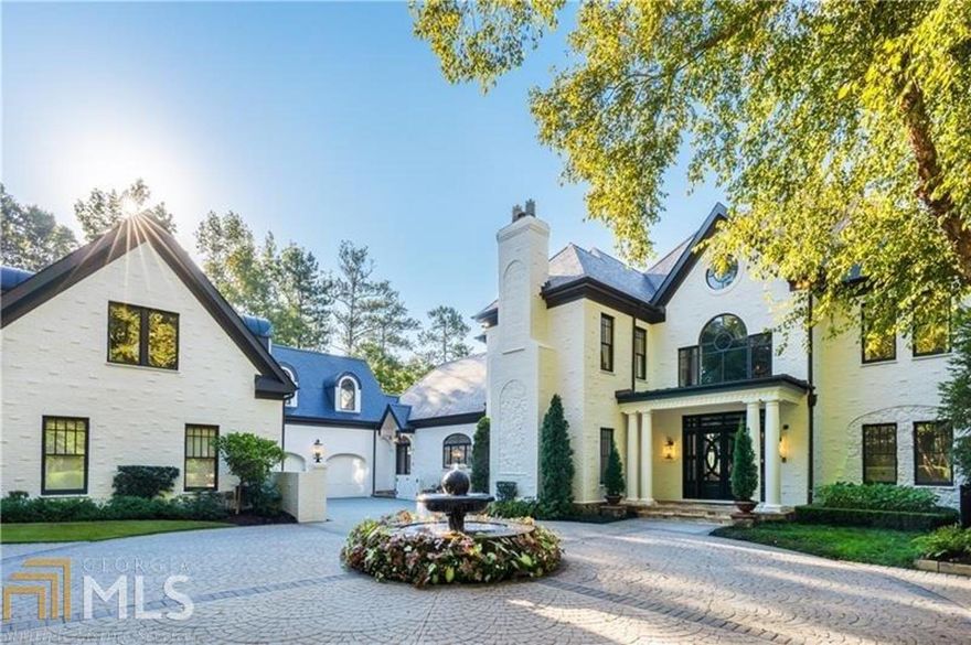 Imagine having a private retreat just minutes from Buckhead. The property features 8.4 usable acres with lake, guest cottage, caretaker home. The residence also features a guest apartment with living room, master bedroom, kitchen and laundry. It has an outside entrance and is over the garages. The latest in Control4 technology, whole house generator, top security, completely fenced with a front and back gate that opens on Indian Trail road. Caretaker/house or home manager office apartment at the back gate away from guest cottage on the lake. The guest cottage overlooks the lake with a screened patio, wood burning fireplace, kitchen and upstairs master with patio overlooking the lake and gazebo. Capable of driving vehicles throughout the property on the golf cart path. New pool and outdoor entertaining pavilion redone with full bath for poolside entertaining and overlooking the property. The property includes golf cart paths, walking trails, waterfalls to the lake, tennis, batting cages and walking trails.  Interiors by Stewart Mohr feature high ceilings, open and bright. The kitchen is open to the family room and out to the pool.  The master wing on the main has private access to the gym downstairs.   Daylight terrace with gym/spa bath, sauna, billiards and wine cellar. Replica of the Fox theater with McIntosh equipment!  The back two acres is set up to build another home or exotic car garage. Even land a helicopter. Close to all private schools. Furnishings negotiable.