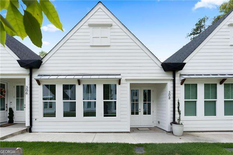 SERIOUSLY RUDUCED! MASTER ON MAIN - LEVEL WALKING DISTANCE TO DOWNTOWN WOODSTOCK This gorgeous 1-story home offers modern living at its finest, all within walking distance of downtown Woodstock. With the master suite and main living areas conveniently located on the main floor, the home also features two additional bedrooms and a flexible loft upstairs. The open-concept layout is enhanced by soaring 16-foot cathedral ceilings and large windows, filling the space with natural light. Luxury finishes include level 3 quartz countertops with waterfall edges, a custom white oak beam accenting the range and fireplace, and a frameless glass shower in the master bath. The main living areas, ownerCOs suite, and upstairs loft feature durable hard flooring, combining style and functionality. The kitchen is a chefCOs dream with soft-close cabinets, pullout trash bins, and rollout pantry drawers, designed for convenience and efficiency. To make moving in effortless, the home also includes a refrigerator and washer/dryer. Loaded with premium upgrades and situated in a prime location, this home is a rare gem!