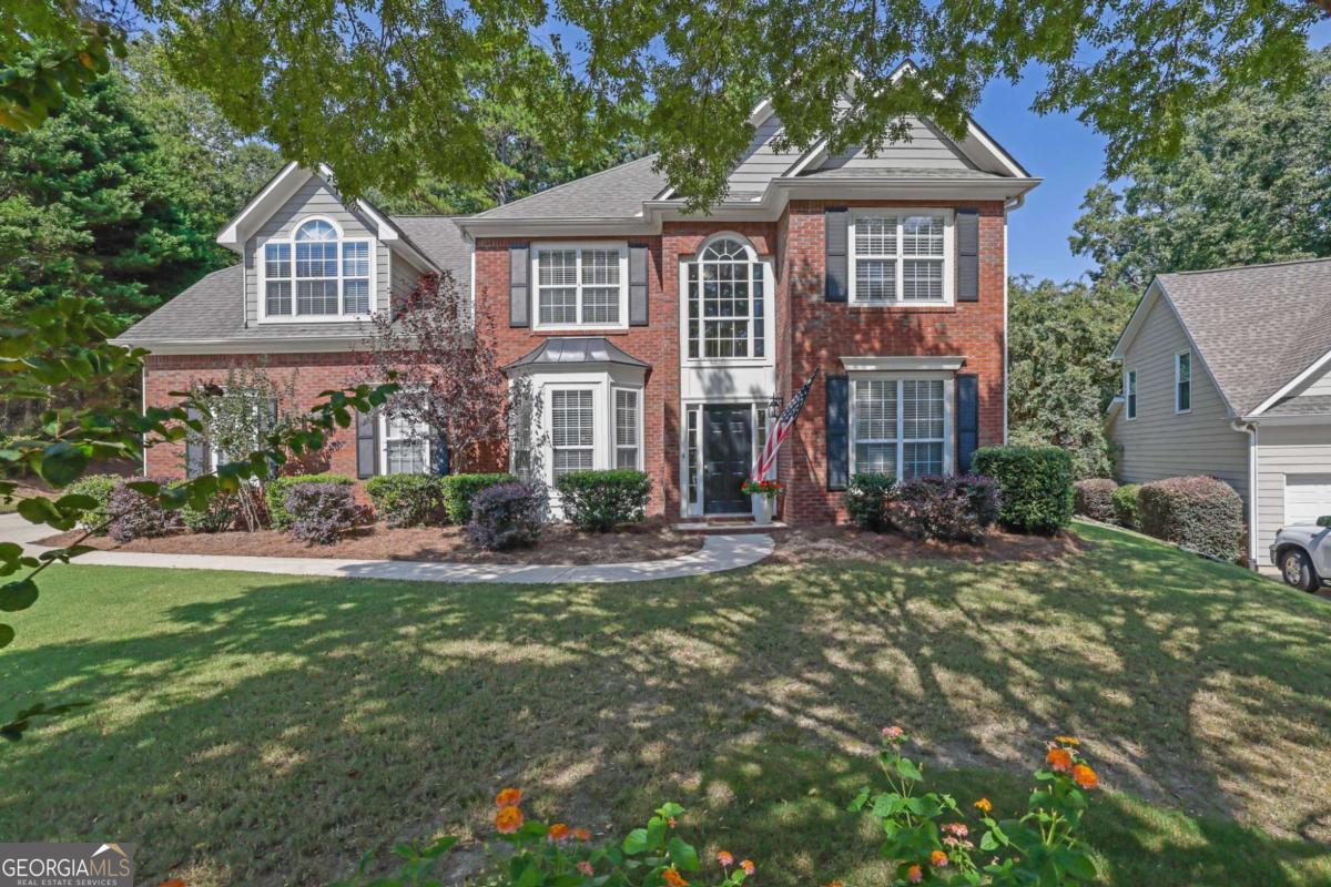 Inviting 4BD/2.5BA in Hamilton Fields - Seckinger HS Zone! Welcome to this immaculate home in highly sought-after Hamilton Fields. Soaring vaulted ceilings and abundant natural light create an inviting atmosphere. The open-concept living space is perfect for entertaining. Fresh paint throughout, including the garage! The kitchen features ample countertop space and stainless steel appliances with eat-in or counter seating options. There is a separate dining room with a bay window for gatherings. The main level includes a flexible space ideal for a home office, playroom, or exercise area. The upper level primary suite is a large retreat with a connected bath, dual split vanities, a separate shower, and a garden tub. Three additional large bedrooms and a full bath complete the upper level. Step outside to a LARGE lush green lawn, perfect for play, relaxation, or a potential pool/garden. This is an ideal setting for barbecues, fire pits, and outdoor gatherings. Neighborhood amenities include a swimming pool, playground, tennis courts, and baseball field. The HOA hosts many events throughout the year. Conveniently located minutes from the Mall of GA, Costco, Lake Lanier Islands, I-85, I985, this home combines modern comfort, functionality and an unbeatable location. Don't miss this move-in-ready gem!