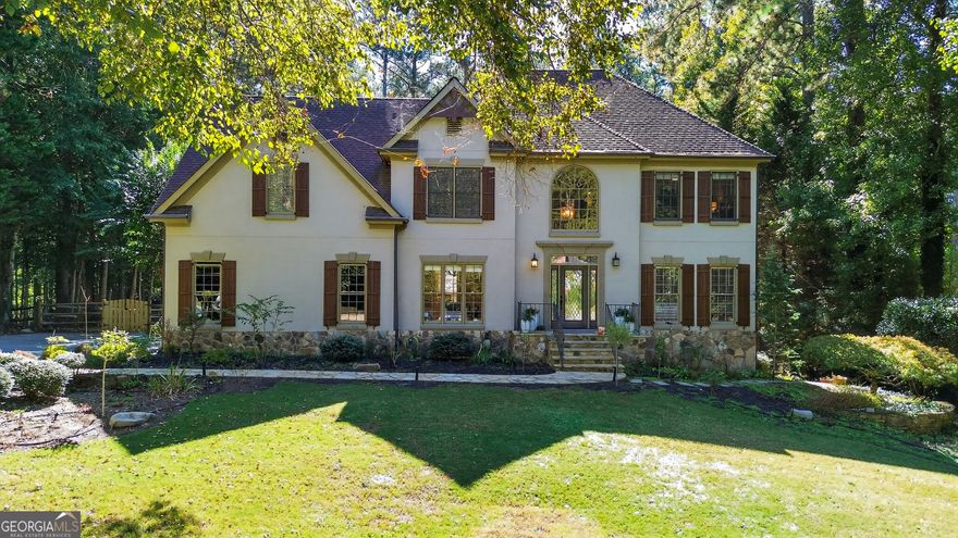 This elegant home perfectly blends sophistication and comfort. The main level features white oak hardwoods throughout the family room, sunroom, office, dining room, kitchen, and Butler's pantry. The updated kitchen shines with new cabinets, granite countertops, and premium appliances. Upstairs offers four spacious bedrooms with hardwoods, including a primary suite with walk-in closet and spa-like bath, plus a second bedroom with private bath and double closets. Enjoy crown molding throughout and cozy nights by the two-story stone fireplace with cedar beams. The finished basement includes a full bath, bedroom, and flexible living space. Step outside to your private retreat with an in ground saltwater pool with slide!, gas stone fire pit, and lush yard perfect for entertaining or relaxing in style.