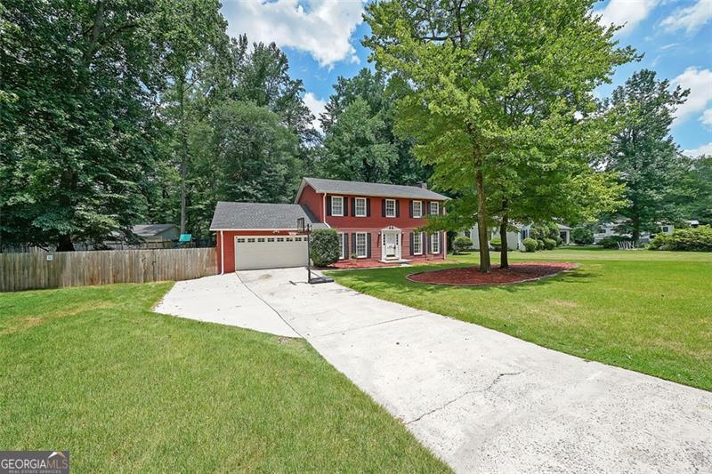 No HOA*Incredible Fenced, Wooded, Lot That Is Perfect For A Swimming Pool*Ideal East Cobb Location & Schools*Not A Stitch of Carpet In The Home*Full Interior Freshly Painted*Remodeled Kitchen Boasts New White Cabinets & Drawers (2 Lazy Susans), Granite, Stainless Steel Appliances That Includes Double Wall Convection Ovens, Glass Backsplash, Can Lights, Walk-In Pantry Plus Cupboard Style Pantry, Can Lights, and Oversized Eat-in Area*Spacious Family Room Accentuated with Floor to Ceiling Brick Fireplace, New Cabinets For The Wet Bar, Can Lights, Crown Molding, & Double French Doors Leading To A Newer Trek Deck with Aluminum Rails & Down To Patio, Yard, & Fire Pit*Large Master Suite with His/Her Closets*Outbuilding, Roof 4.5 Years Old, 6" Gutters Installed 2023, A/C 2017, Whole House Attic Fan* Tax Record's Lot Size Is Not Correct*Crawl Space Is Encapsulated*