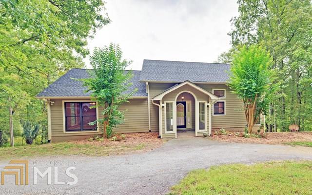 "On Tranquil Pond"! This large recently renovated 5BR/3BA home features an open floor plan with views of your private back yard and pond. The main level host a double sided gas fireplace, gorgeous updated kitchen with new granite, oven/range, wine cooler, dishwasher and crisp white cabinets. A super sized master suite, beautifully styled bath w/soaking tub, separate shower, double vanities and walk in closet, and a guest bedroom complete the main level. The finished terrace level offers 3BR/1BA and a large family/rec room, and separate study/office or home school room with tons of windows that fill this home with light! Fresh paint throughout, new carpet, new tile, refinished hardwood and MORE! All paved roads w/easy access to Hwy 515 & Mins to Lake Nottely