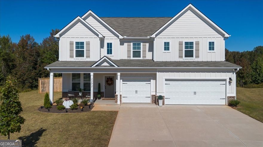 Luxury meets lifestyle in this like-new 5 Bedroom retreat! Tucked away in a quiet cul-de-sac on nearly 2 acres, this home delivers modern elegance, natural light, and an open floor plan that lives as beautifully as it entertains. The main level highlights include a coffered-ceiling dining room, executive trim package, and a versatile 5th bedroom for guests or a home office. The chef's kitchen features quartz countertops, Samsung Bespoke appliances, and an oversized island overlooking the family room. Upstairs, a spacious loft adds flexibility, and the expansive primary suite offers a sitting area plus a spa-inspired ensuite with stone-core flooring, soaking tub, and walk-in shower. Every inch of this home exudes quality, space, and sophistication. Don't just dream it-live it. Schedule your private tour today and experience the comfort, elegance, and space this home offers.