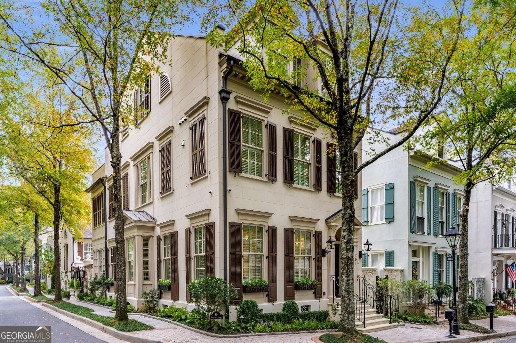LUXURY LIVING MEETS HISTORIC CHARM IN NORTH COVE! THIS EXQUISITE MASTERPIECE HAS BEEN REIMAGINED AND RENOVATED WITH THE FINEST FINISHES AND DESIGNER TOUCHES INCLUDING A "MAGICAL" POOLSIDE COURTYARD AND PRIVATE CARRIAGE HOUSE STYLE SUITE! This AMAZING "million dollar" transformation, designed by Jim Strickland and handcrafted by John Bynam Homes, will rival any penthouse on 5th Avenue and is located in one of Peachtree City's most desirable lake communities, a quaint sidewalk neighborhood featuring intimate parks, street lined fountains, and gas lanterns, reminiscent of historic Savannah! Open the front door to discover three finished levels of unsurpassed quality, glamorous lifestyle and impressive attention to every detail, perfect for the most discerning buyer! Carefully selected features include rich custom millwork, solid wood doors, Rocky Mountain Hardware, designer lighting, scagliola stone mantels and range hood by Francois & Co., quartz & granite counters, Rohl fixtures, professional appliances including Wolf range and Subzero Fridge, intricate tile work, built in closets, custom iron work, and hand forged brass stair handrail, heated limestone flooring on main level and rich wide plank hardwood flooring on upper two levels! The gorgeous light filled living room, just off the foyer, is perfect for a grand piano, library or home office! Next, this kitchen is truly the heart of this home and could be on the cover of any magazine, fully equipped with a Wolf commercial 8 burner range, dual ovens, Subzero fridge, microwave drawer, dishwasher, and ice maker...all completely open to the spectacular "grand" room and dining room! You will fall in love with the dramatic beamed ceilings, elegant Italian stone surround fireplace, and exquisite built-in bar with refrigerator drawers plus "hidden" armoire! Open the sliding doors and relax on the balcony with your favorite beverage overlooking the courtyard pool while enjoying the cascading waterfalls and glow of the fire bowls under the stars at night! The exquisite primary bedroom encompasses the entire second floor and is complete with morning bar, sitting area with fireplace, and covered outdoor balcony overlooking the poolside courtyard! The luxurious primary bathroom is enhanced by beautiful double vanities with honed granite counters, oversized shower, air jetted tub, mosaic tile inset, his and her closets, plus direct access to a well-appointed laundry room with jetted sink for delicate washables and even a dryer closet! The third-floor addition features 2 generously sized bedrooms, each connected to a lovely Jack and Jill bathroom, each with its own vanity. The extraordinary outdoor living area features a heated Pebble Tec courtyard pool with fountains, fire bowls, and a summer kitchen with grill and beverage refrigerator. The 4th bedroom with full bath is above the heated 2.5 car garage which is a huge flex space perfect for a teen/in law-suite, home office or gym! You will discover exceptional quality at every turn in this amazing home! North Peachtree City location with access to 100+ miles of cart paths, convenient to Trilith Studios, Fayette & Newnan Piedmont Hospitals, Atlanta Airport, dining & shopping! A TRUE TREASURE RIGHT HERE IN PEACHTREE CITY!
