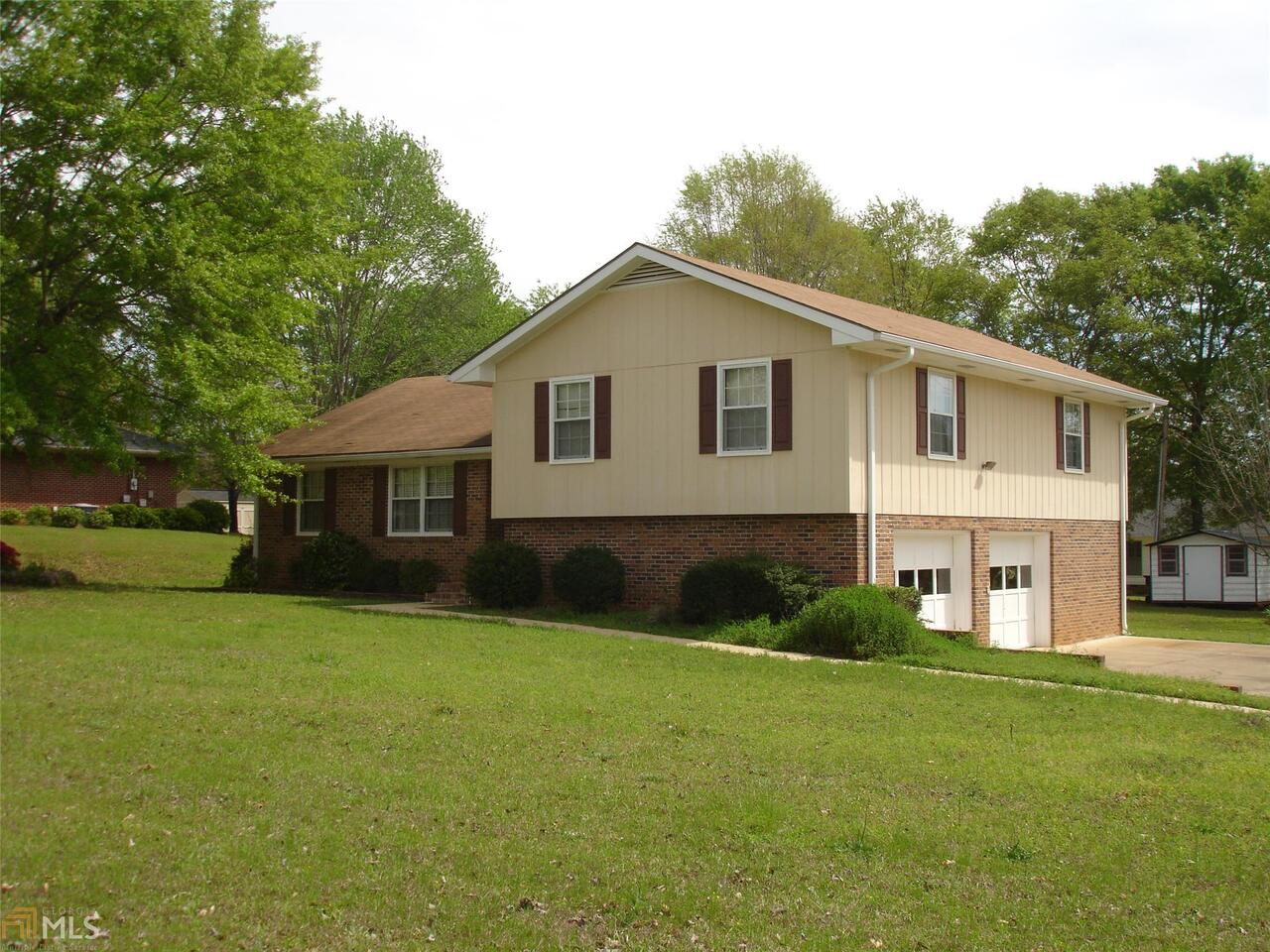 Nice, large corner lot with poured patio, out-building. Over-sized kitchen with lots of counter space. Breakfast bar open to Dining Room, new flat cooktop and micro. Buck stove insert in bricked fireplace in family room. All bedrooms up and garage down in the split level home. This is a lovely home that has been well maintained. Some updates in kitchen and baths and new carpet. This one is move in ready.