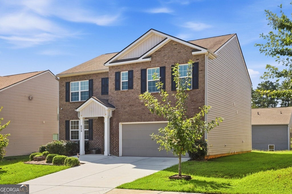 Photo of 626 Yazzie Place, Atlanta, GA 30349 (MLS # 10850385)