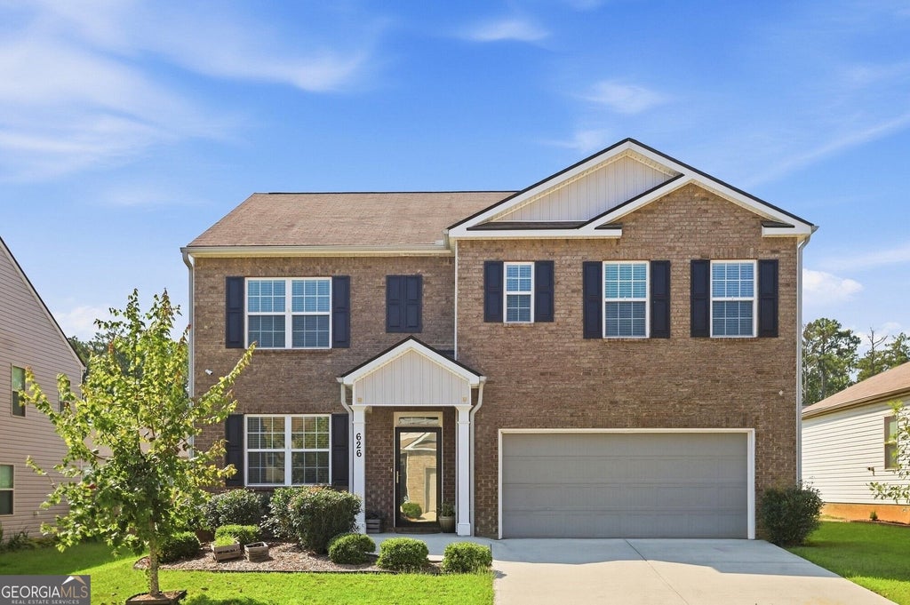 Photo of 626 Yazzie Place, Atlanta, GA 30349 (MLS # 10850385)