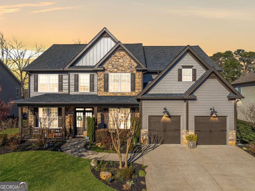 This beautifully renovated Craftsman home sits on a half-acre landscaped lot in the Caney Creek Subdivision. This home welcomes you with a large covered front porch. Upon entering through the French doors, you are greeted by a grand two-story foyer that sets the tone for the renovations throughout. To the left of the foyer is a stylish living room or office space featuring a warm accent wall, while to the right, youCOll find a formal dining room perfect for hosting gatherings. The main floor offers a convenient guest bedroom with a full bath, ideal for visitors or multi-generational living. As you enter the two-story great room, showcasing a breathtaking floor-to-ceiling wall of windows that flood the space with natural light. Custom built-in bookshelves frame a beautifully designed gas log fireplace, creating a warm and welcoming atmosphere. Experience the joy of the completely updated kitchen with a custom range hood, a stunning waterfall granite island, and a walk-in pantry with a custom sliding door. The spacious laundry room features built-in cabinets and a laundry sink conveniently located on the main floor. Upstairs, the oversized primary suite is a serene retreat filled with natural light and features a custom walk-in closet with built-in shelving. The luxurious primary bath offers a custom tile shower with a frameless glass surround, a soaking tub, a double vanity, and radiant heat flooring for the ultimate comfort. Three secondary bedrooms share a generous-sized bathroom. Outside, the spacious, level yard is landscaped with flowering bushes and fully fenced for privacy. A shed is located in the backyard for additional storage. The complete home security system incorporates multiple cameras, sensors for first-floor windows and doors, and smoke detectors for added peace of mind. Community amenities include a saltwater pool and a playground. Located in the top-rated Lambert High School District of Forsyth County. Close to Caney Creek Preserve Park, Big Creek Greenway, Sharon Springs Sports Complex, and shopping/dining hotspots like Halcyon & The Collection at Forsyth. Convenient access to GA 400 and Hwy 141.