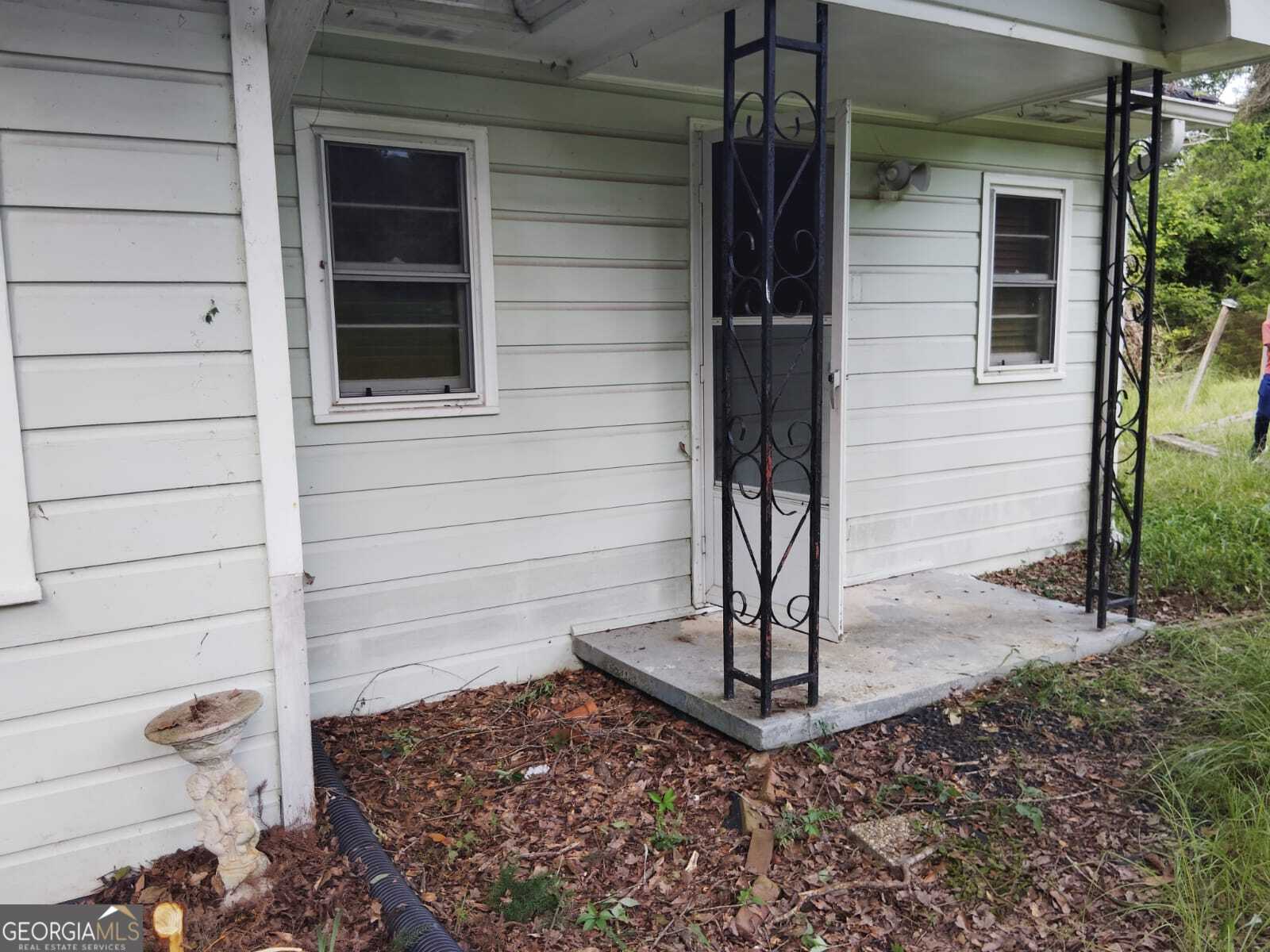 2/1 House is in a quiet neighborhood, grassed, and on one acre touching road frontage. Interior well-kept and clean, septic needs updated repair. priced to sell, roof intact (about 9 years old). Do some TLC to get a great rental or first-time home. accepting offers